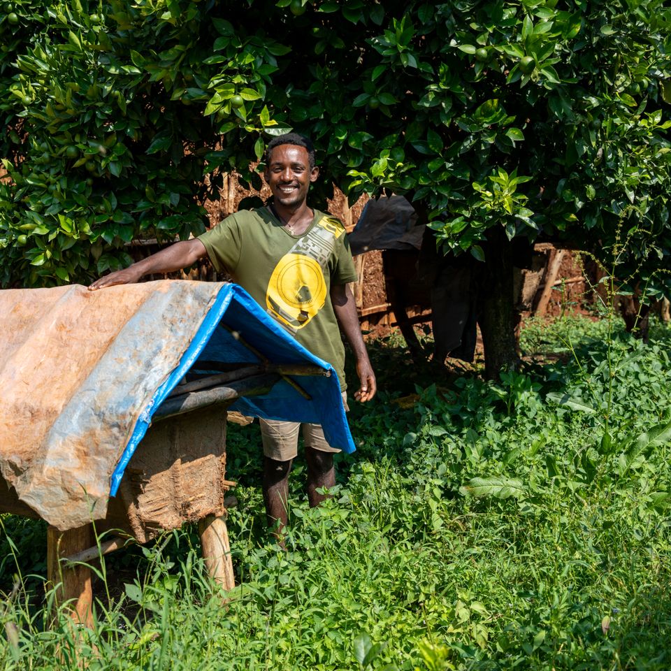 Beekeeper by bee hive in Ethiopia