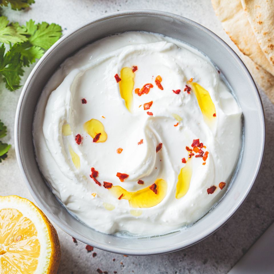 a bowl of feta dip with hot honey