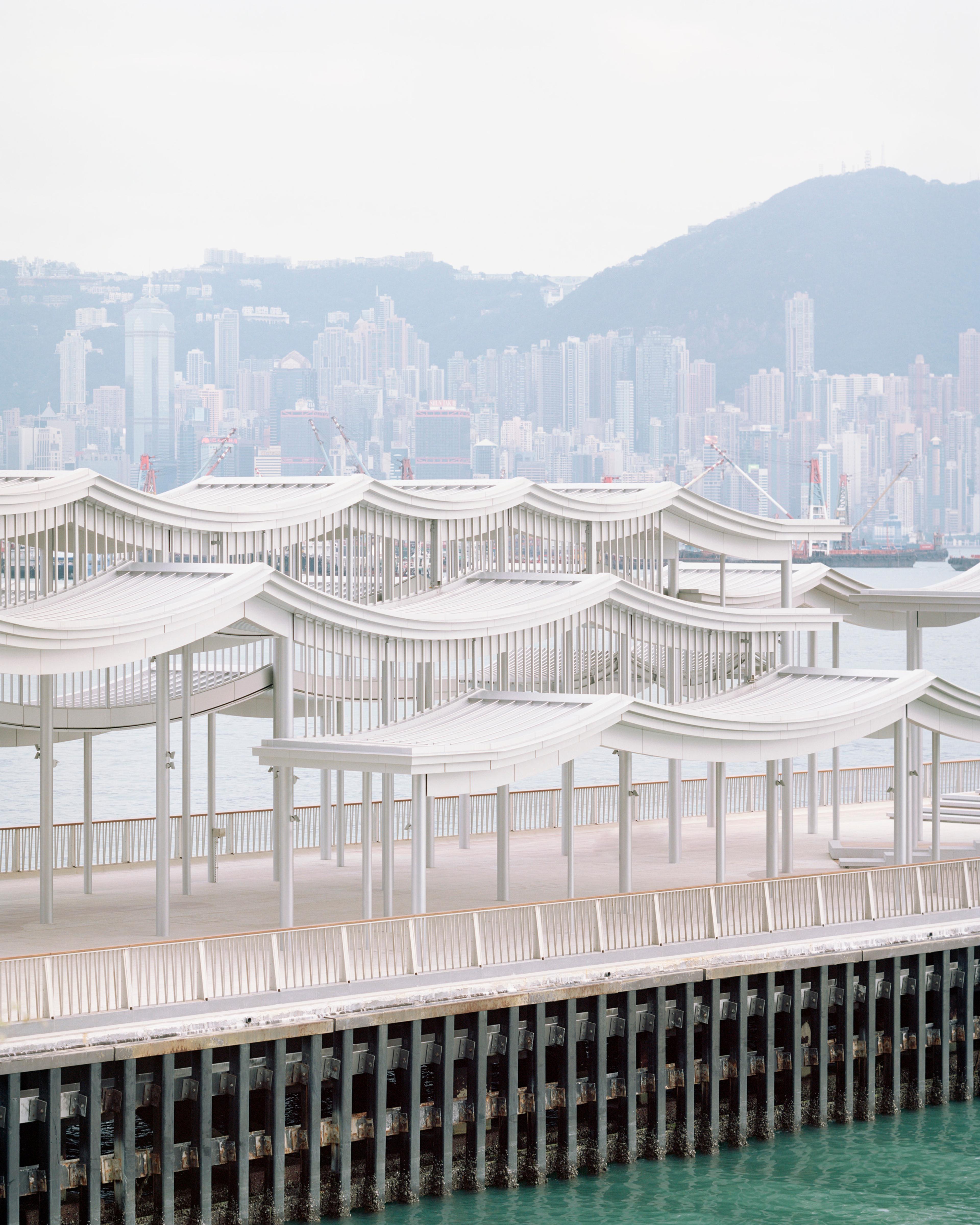 Elevation view of pier canopy with Hong Kong skyline in the background