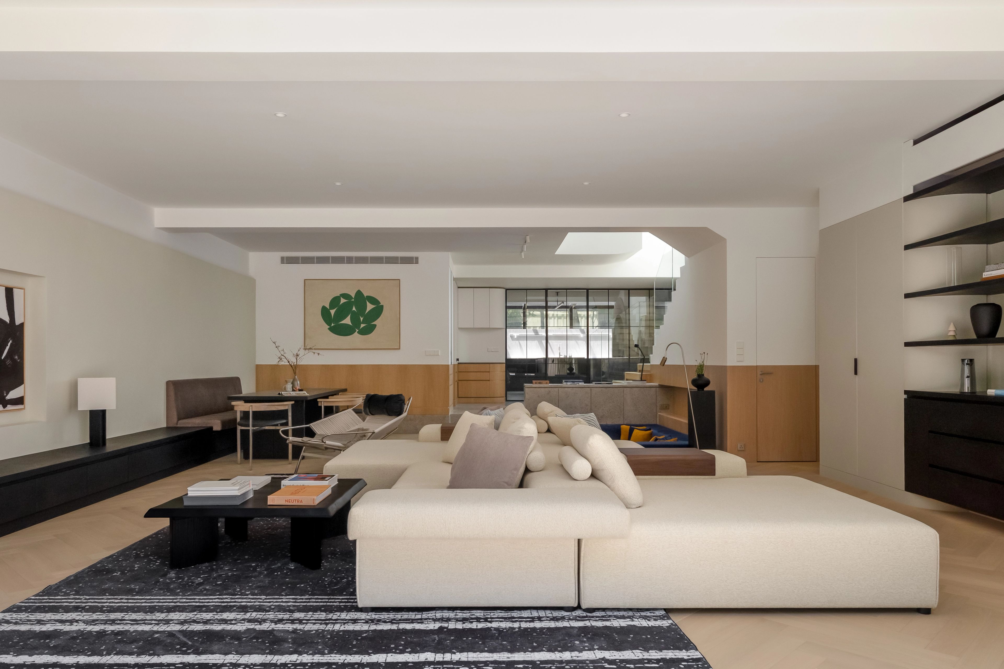 Living room with modular sofa and wood flooring