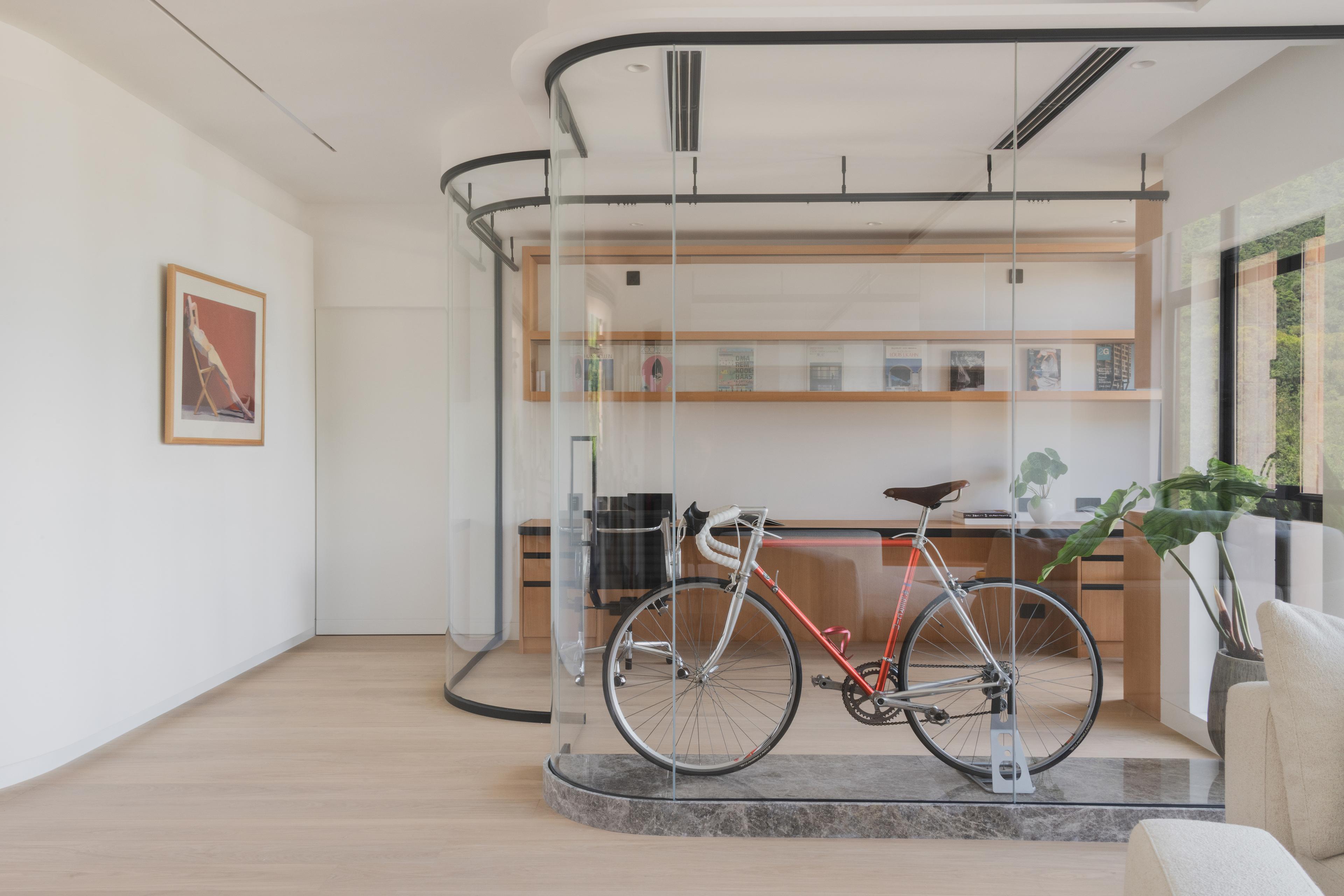 View of glass study with bicycle