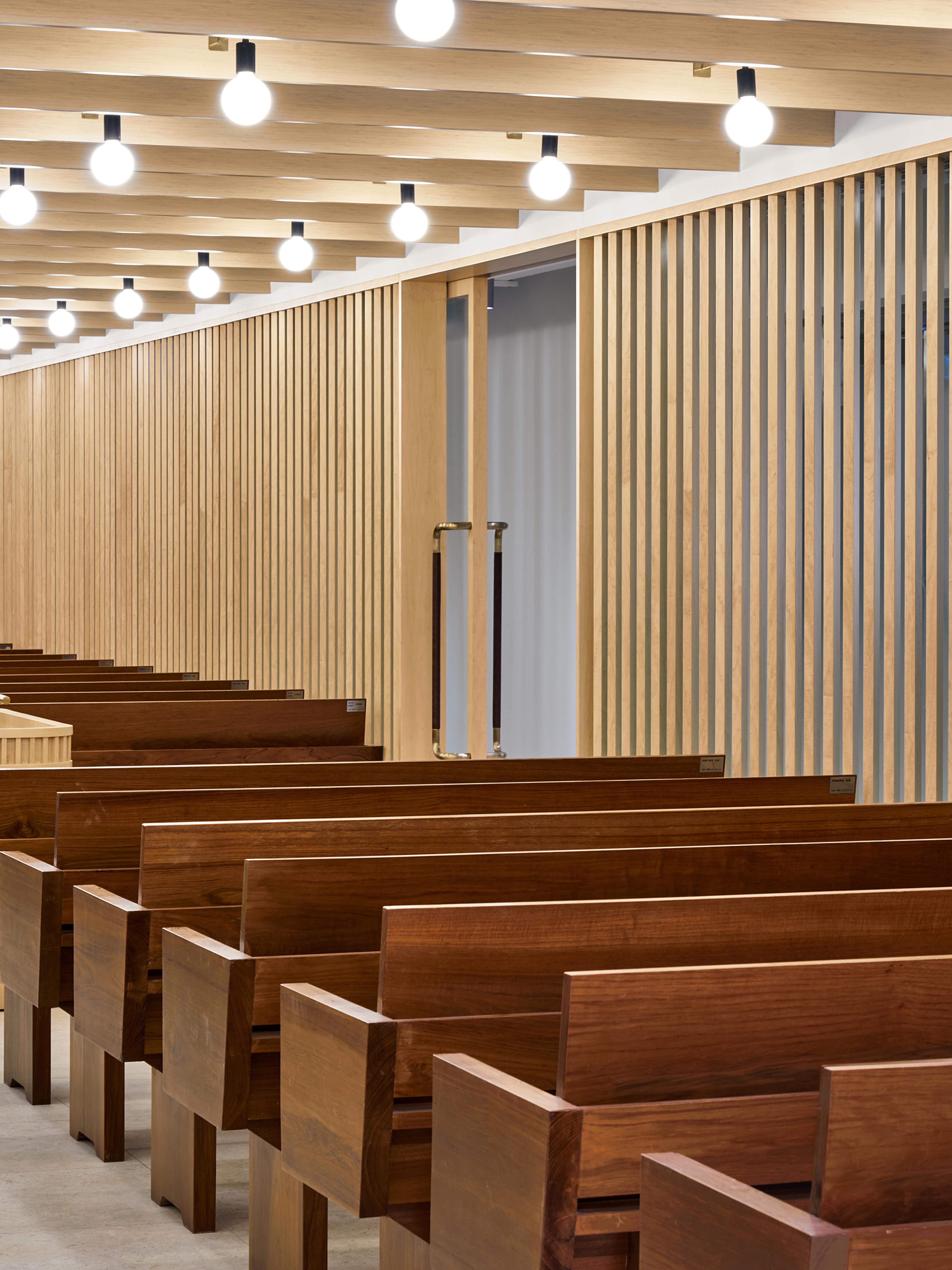 modern church interior with pews and lights