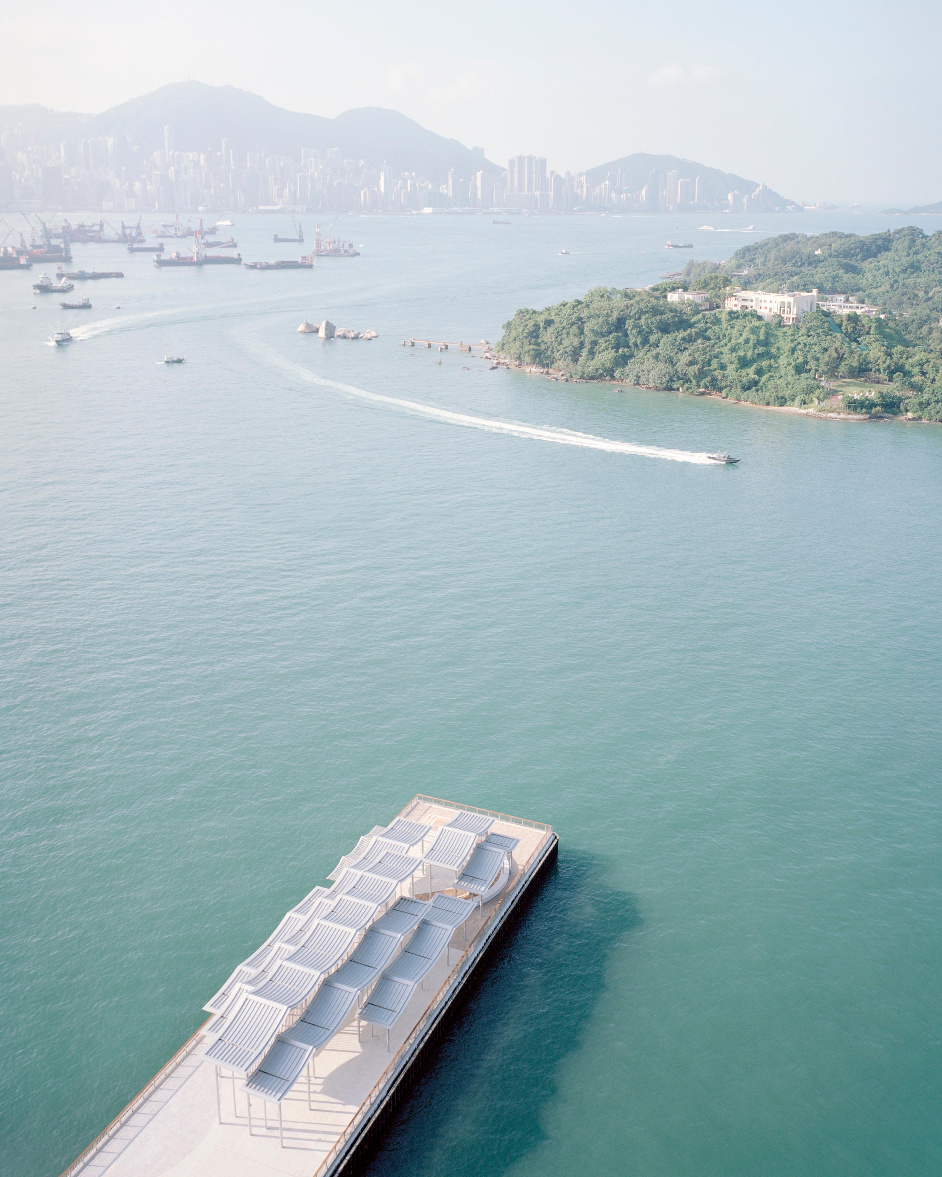 Aerial view of pier canopy with boats and Hong Kong Island in the background