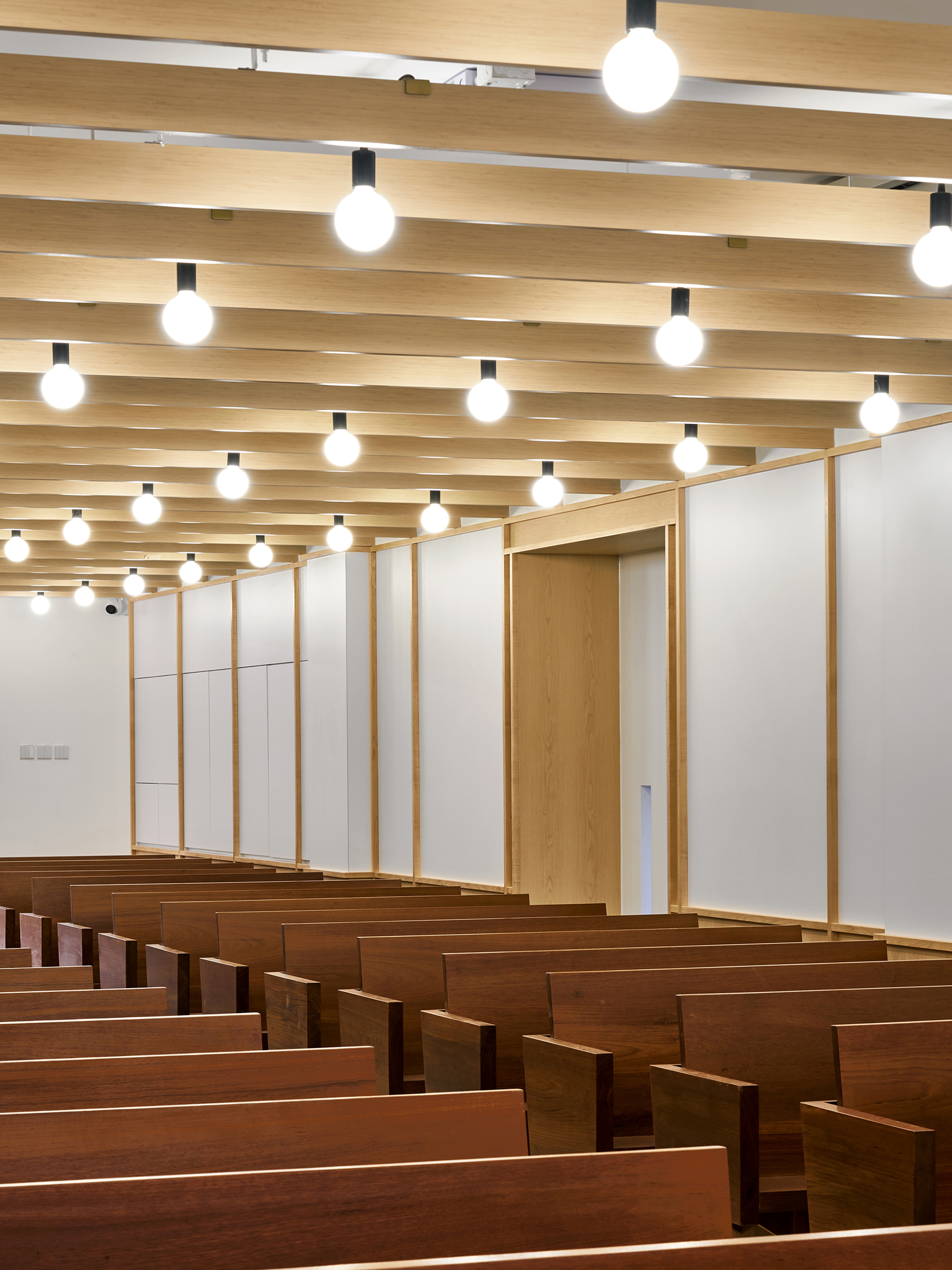 modern church interior with pews and lights