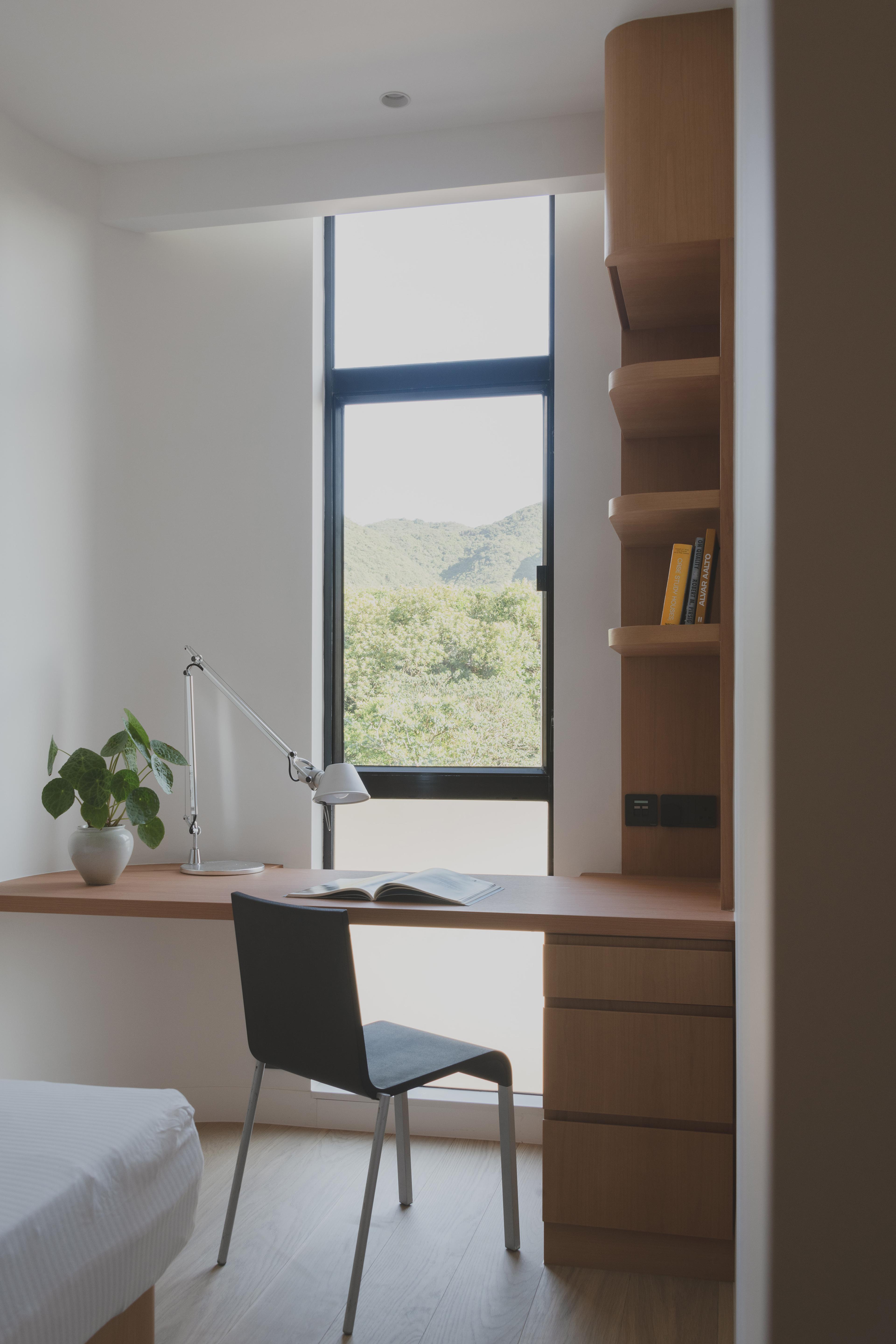 Bedroom study desk with window and mountain view