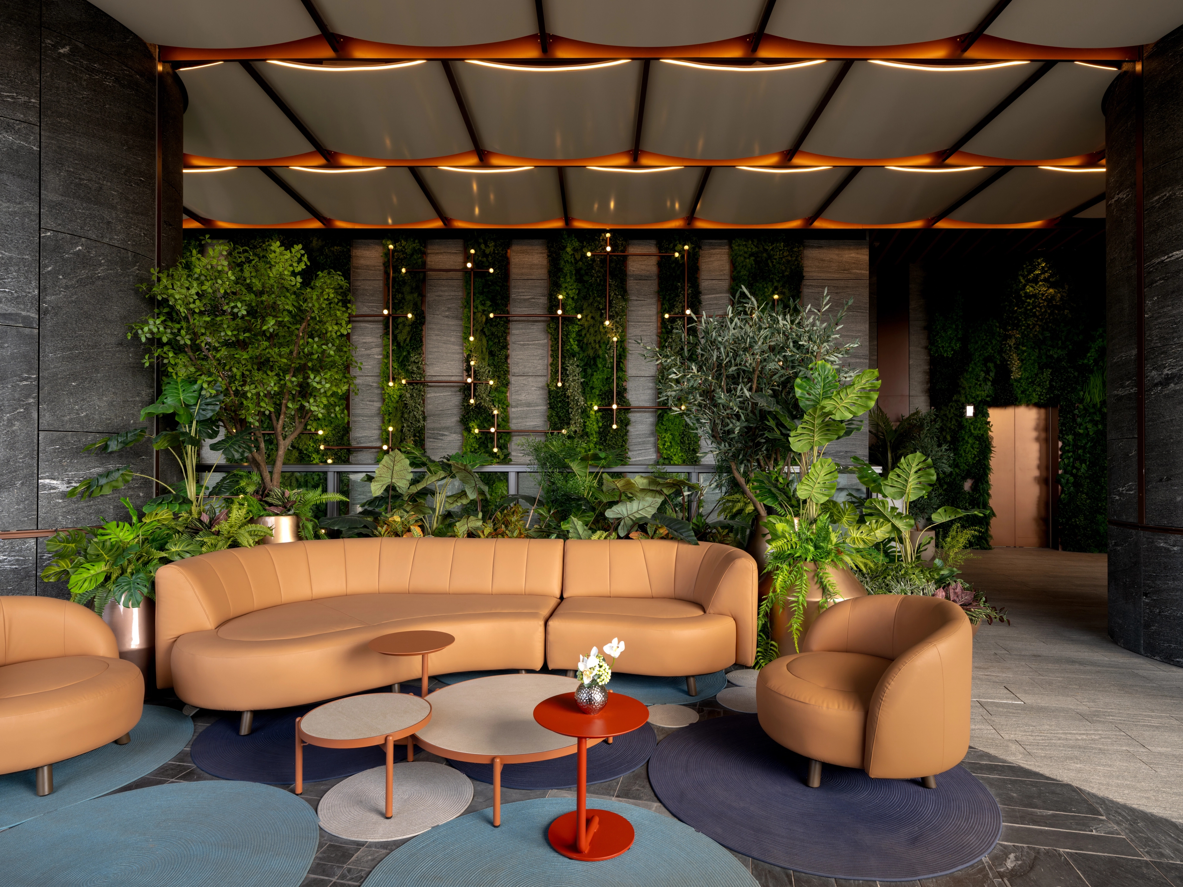 Sky garden lounge with green wall and feature ceiling