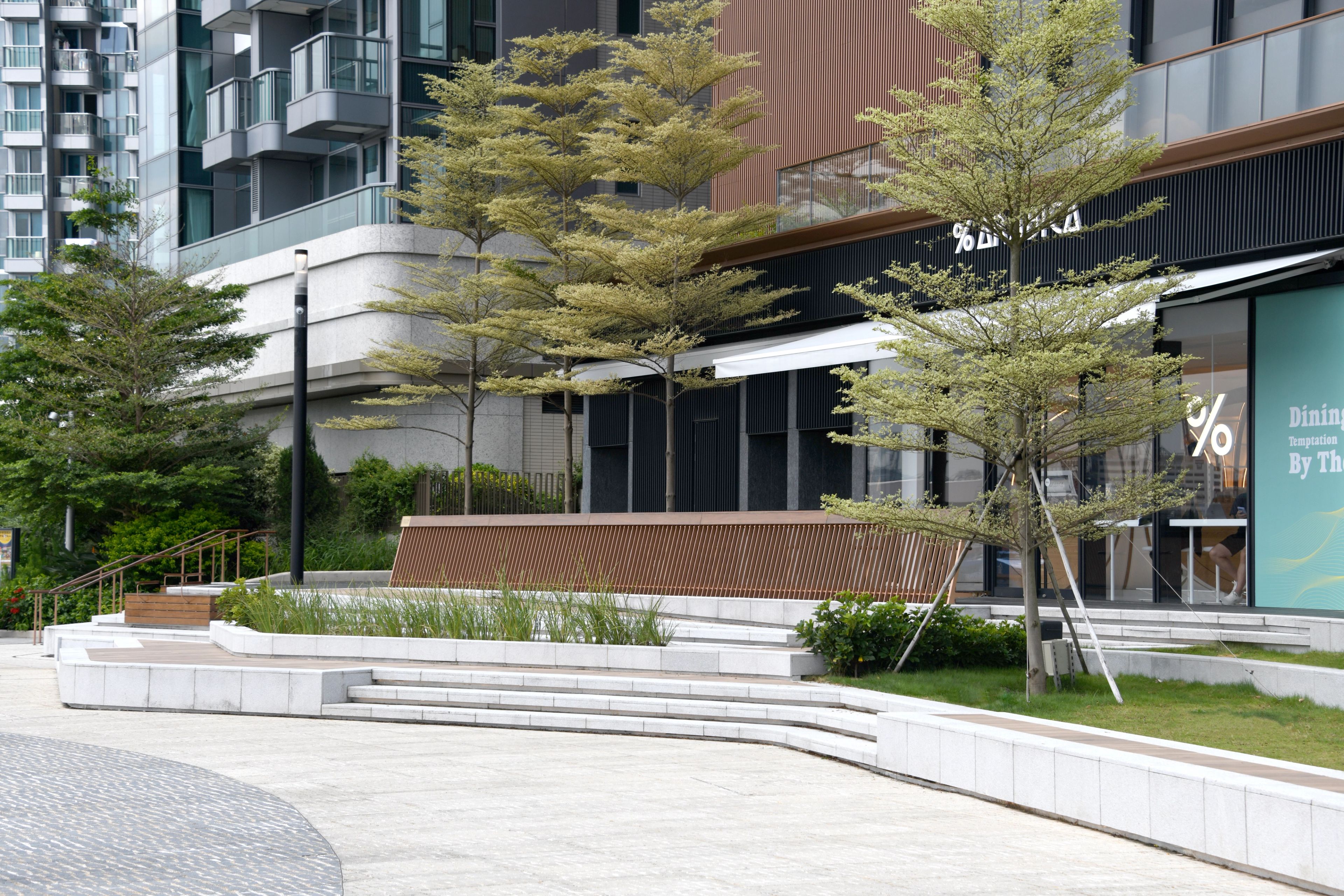Curved stone steps with seating and high wood table