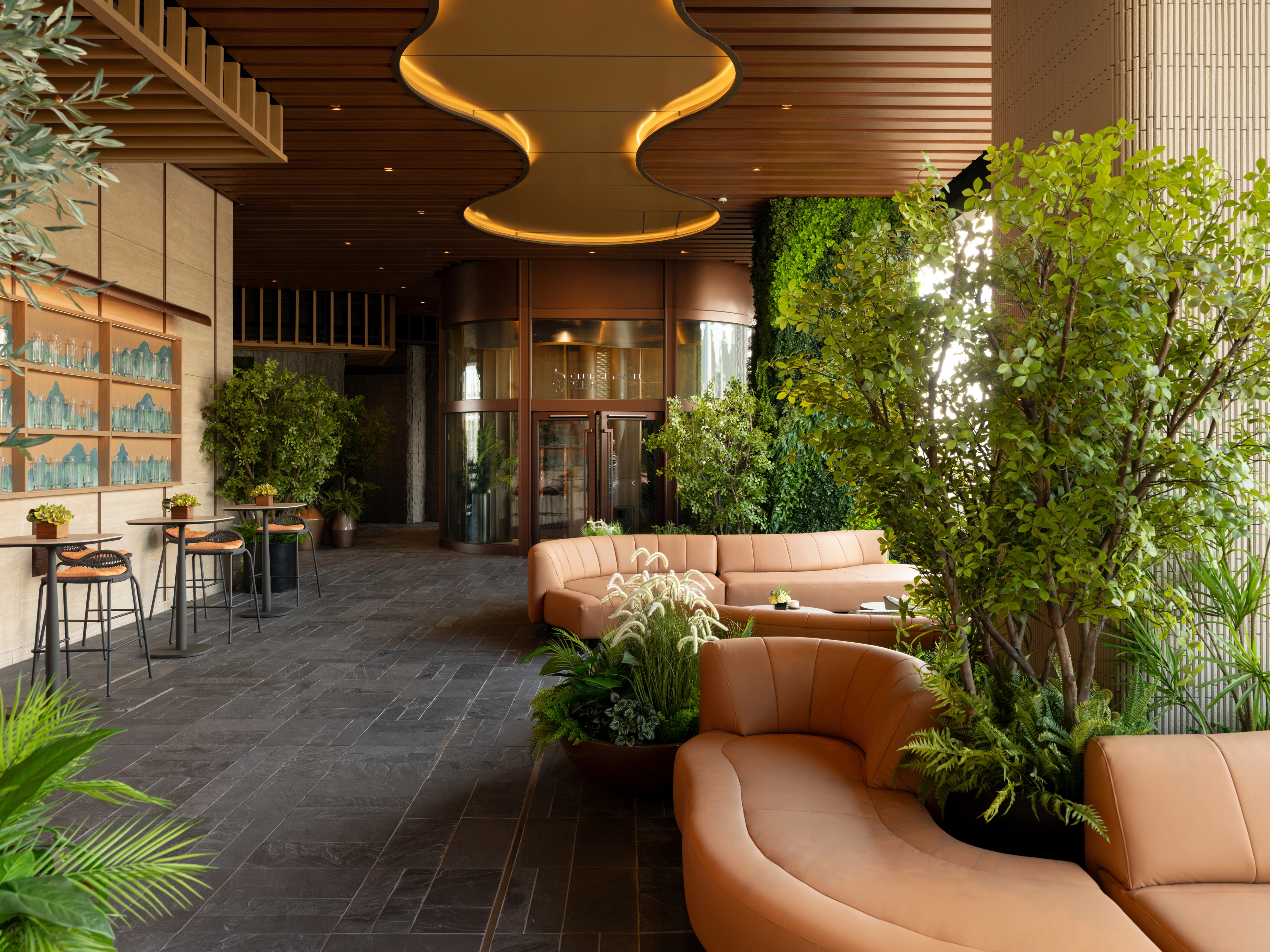 lounge area facing clubhouse entrance with feature light ceiling