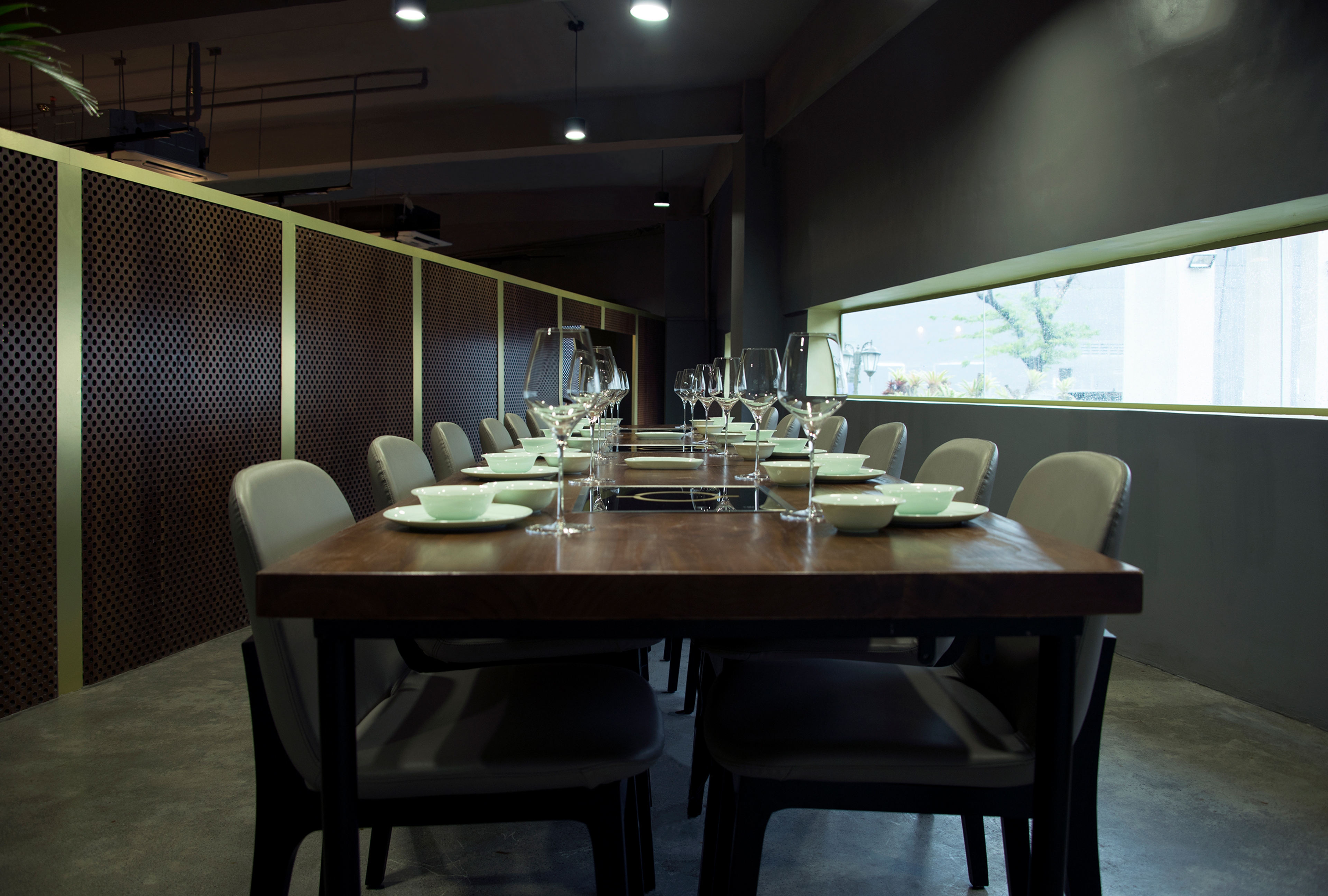 modern restaurant interior with long table and chairs