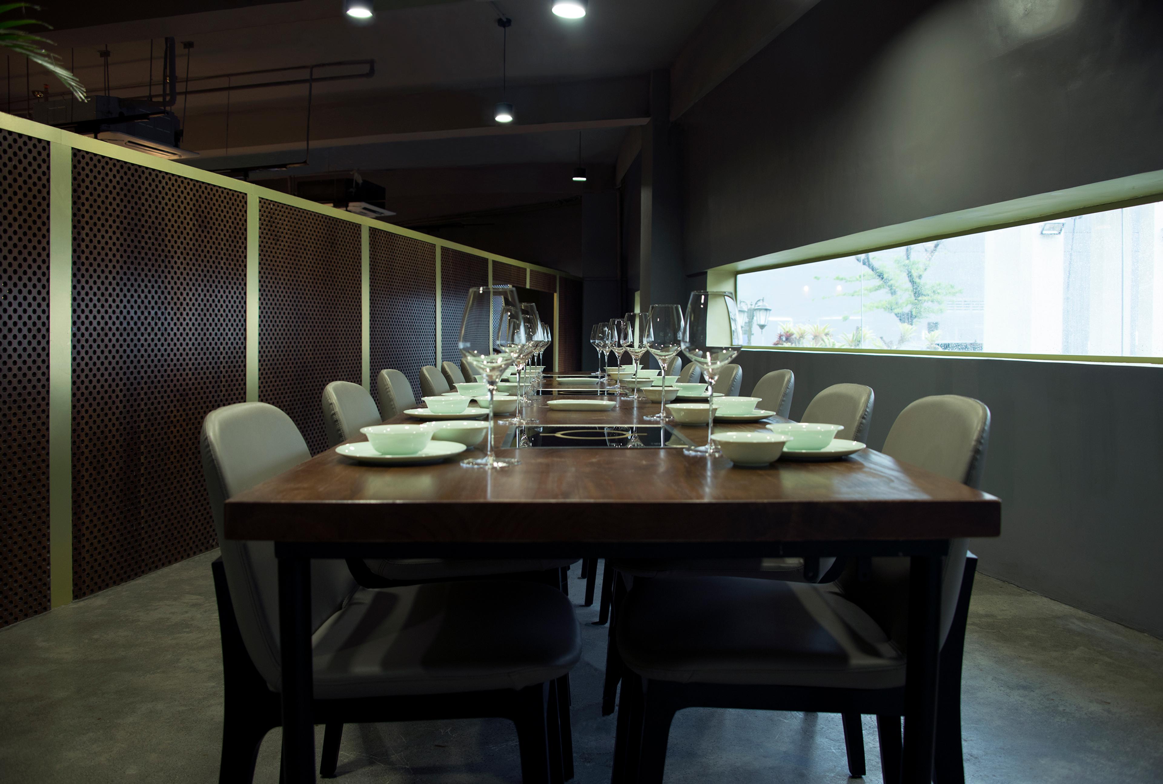 modern restaurant interior with long table and chairs