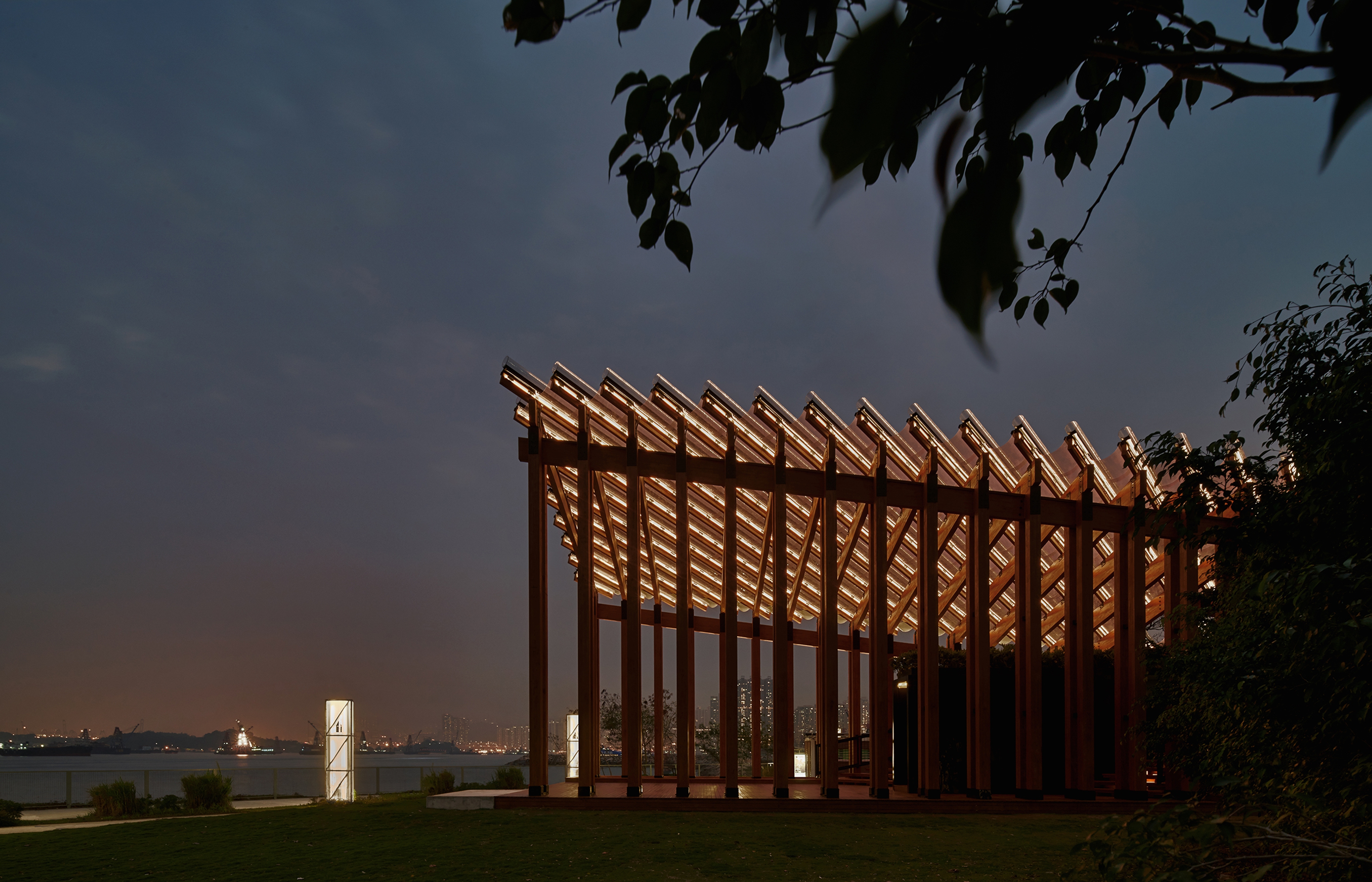 Dimly lit pavilion structure in night time on the harbourfront