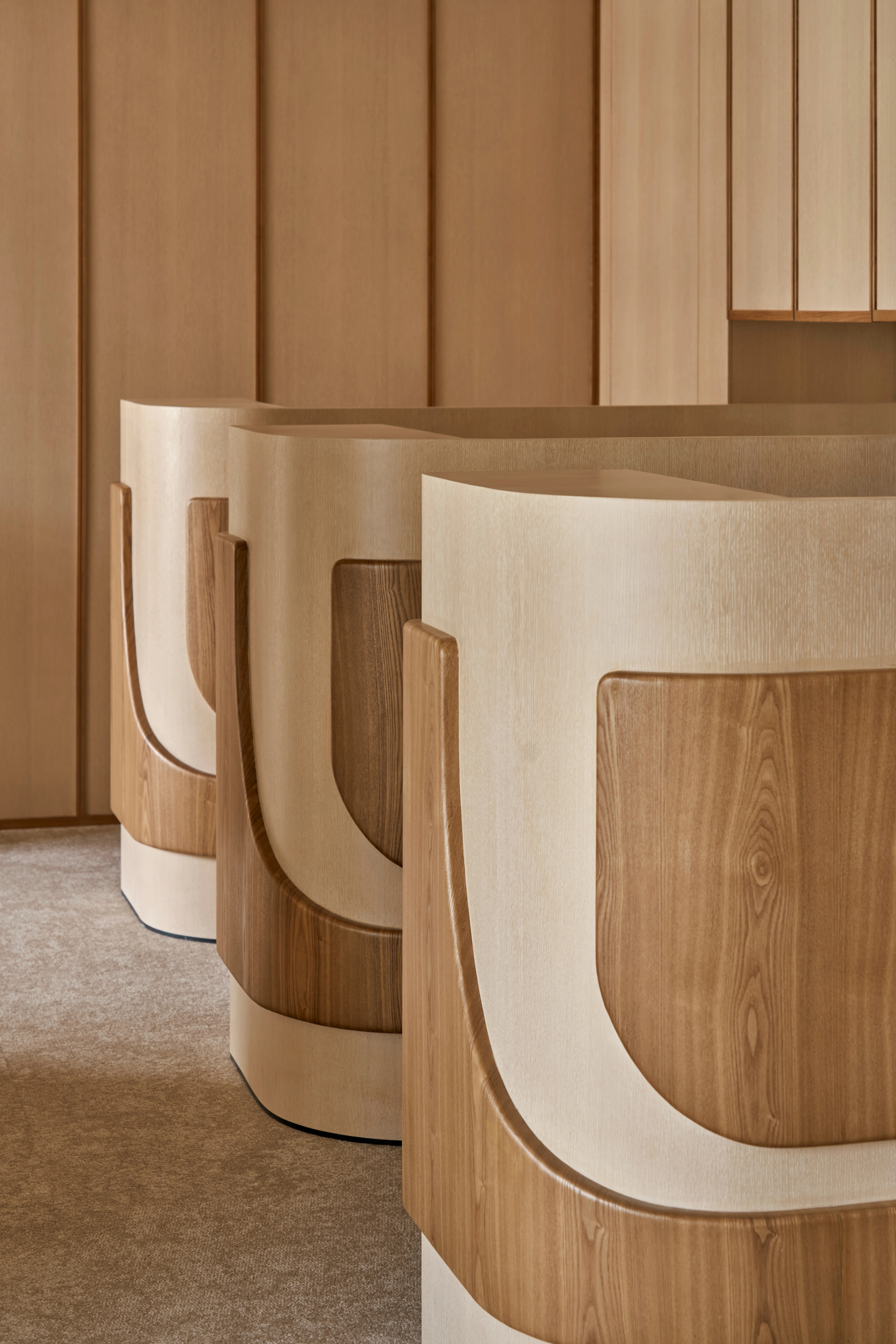 softly curved wooden surfaces exude warmth and sophistication