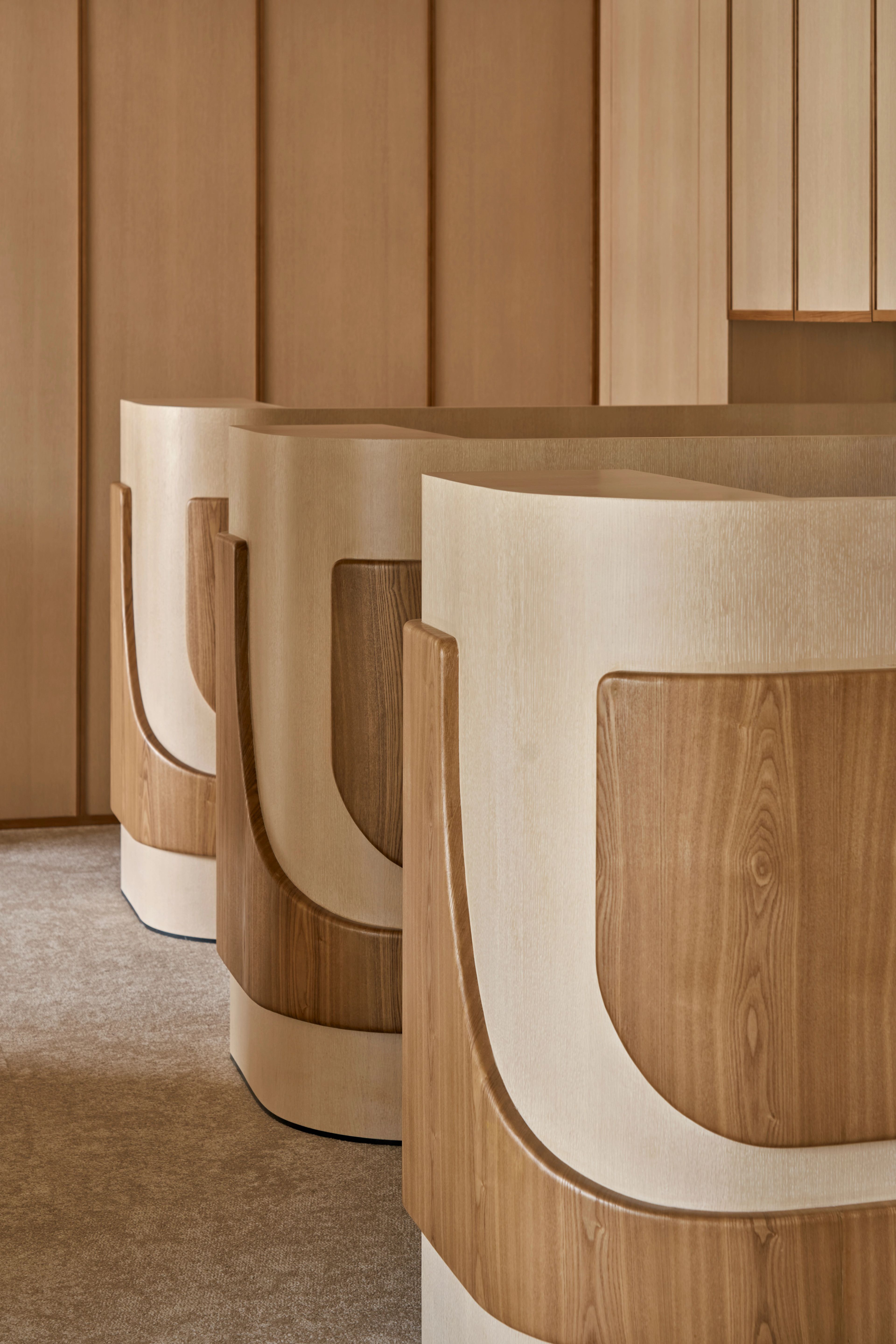 softly curved wooden surfaces exude warmth and sophistication