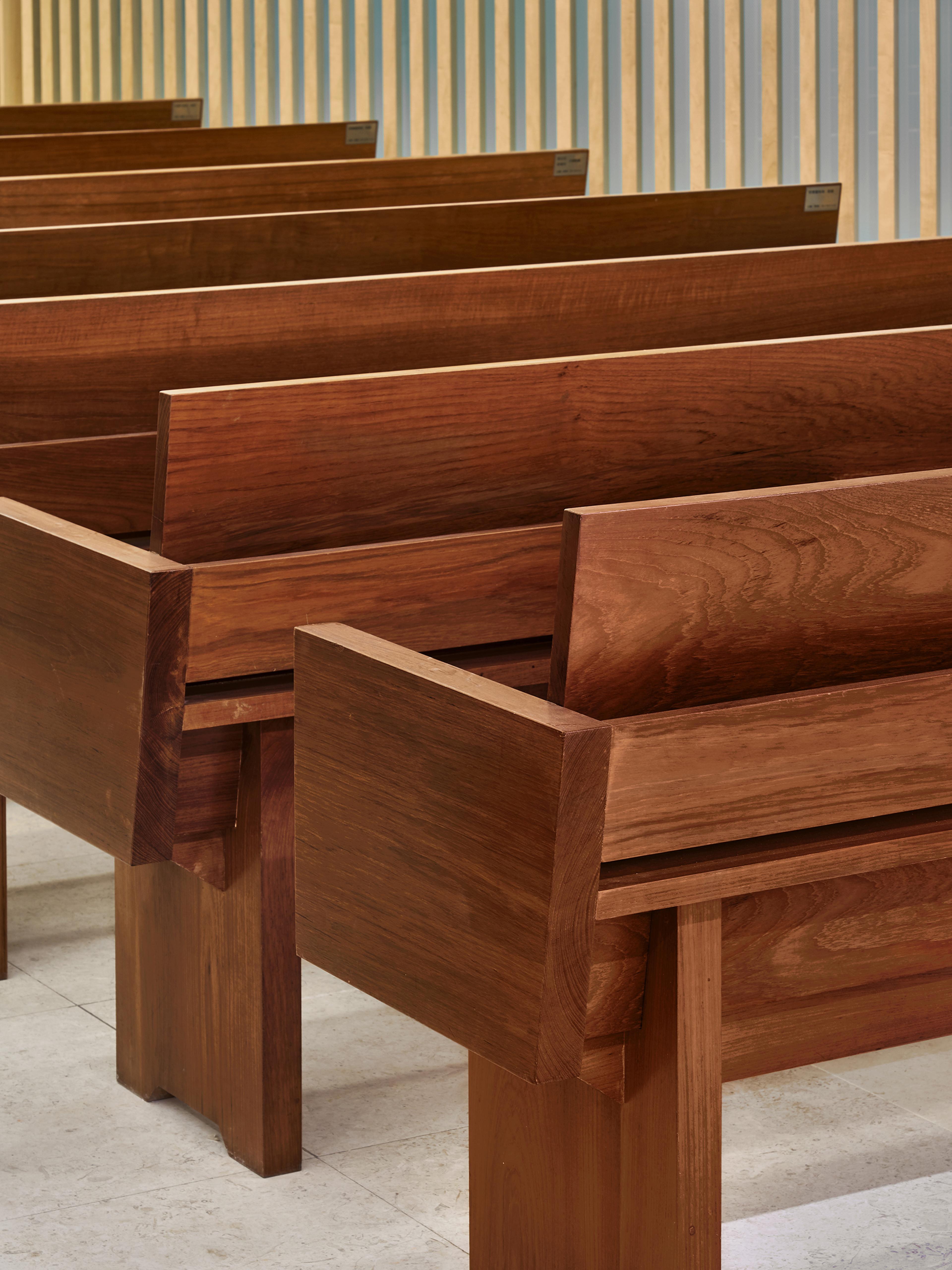 modern church interior with close up of pews