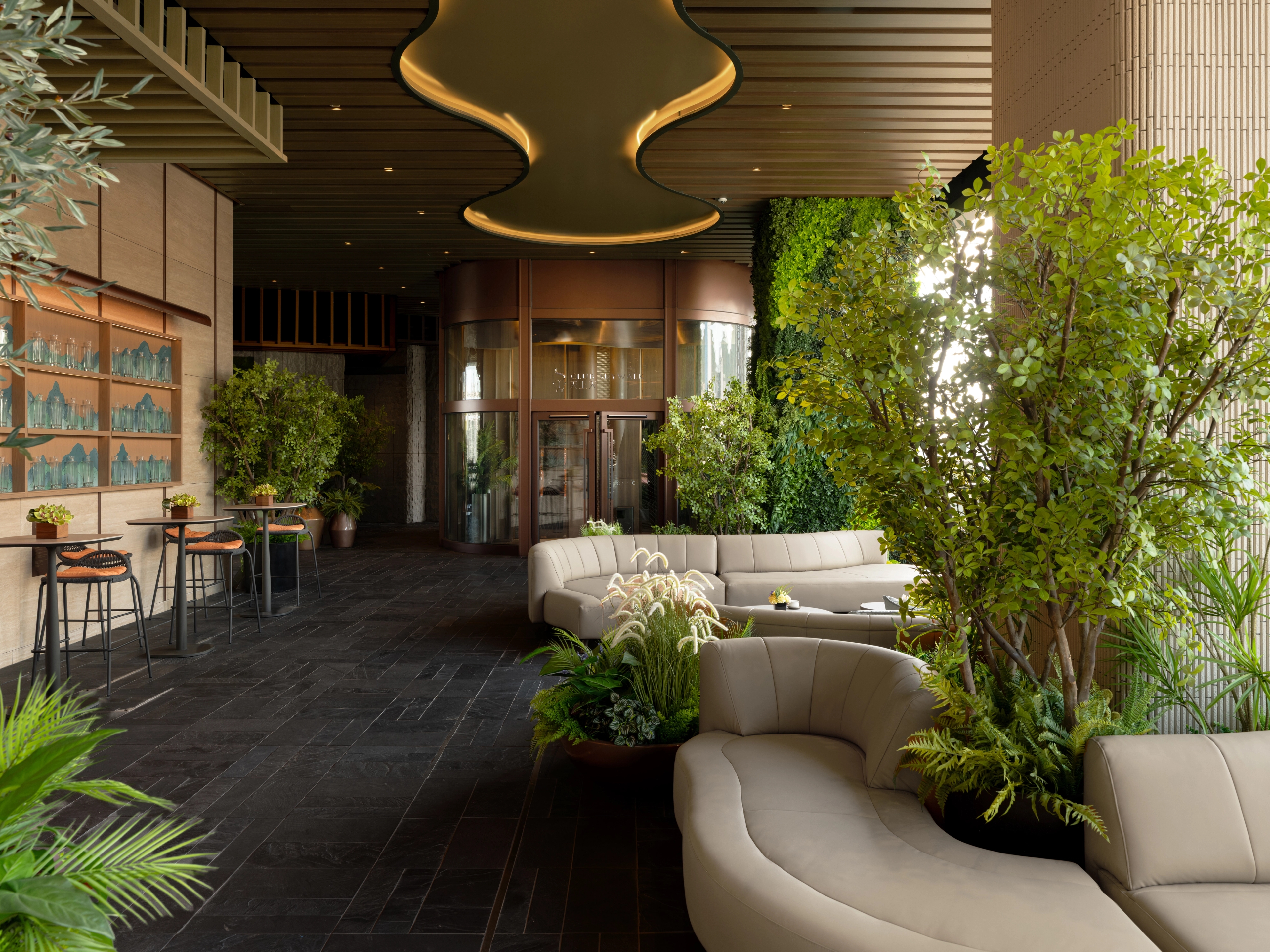 lounge area facing clubhouse entrance with feature light ceiling