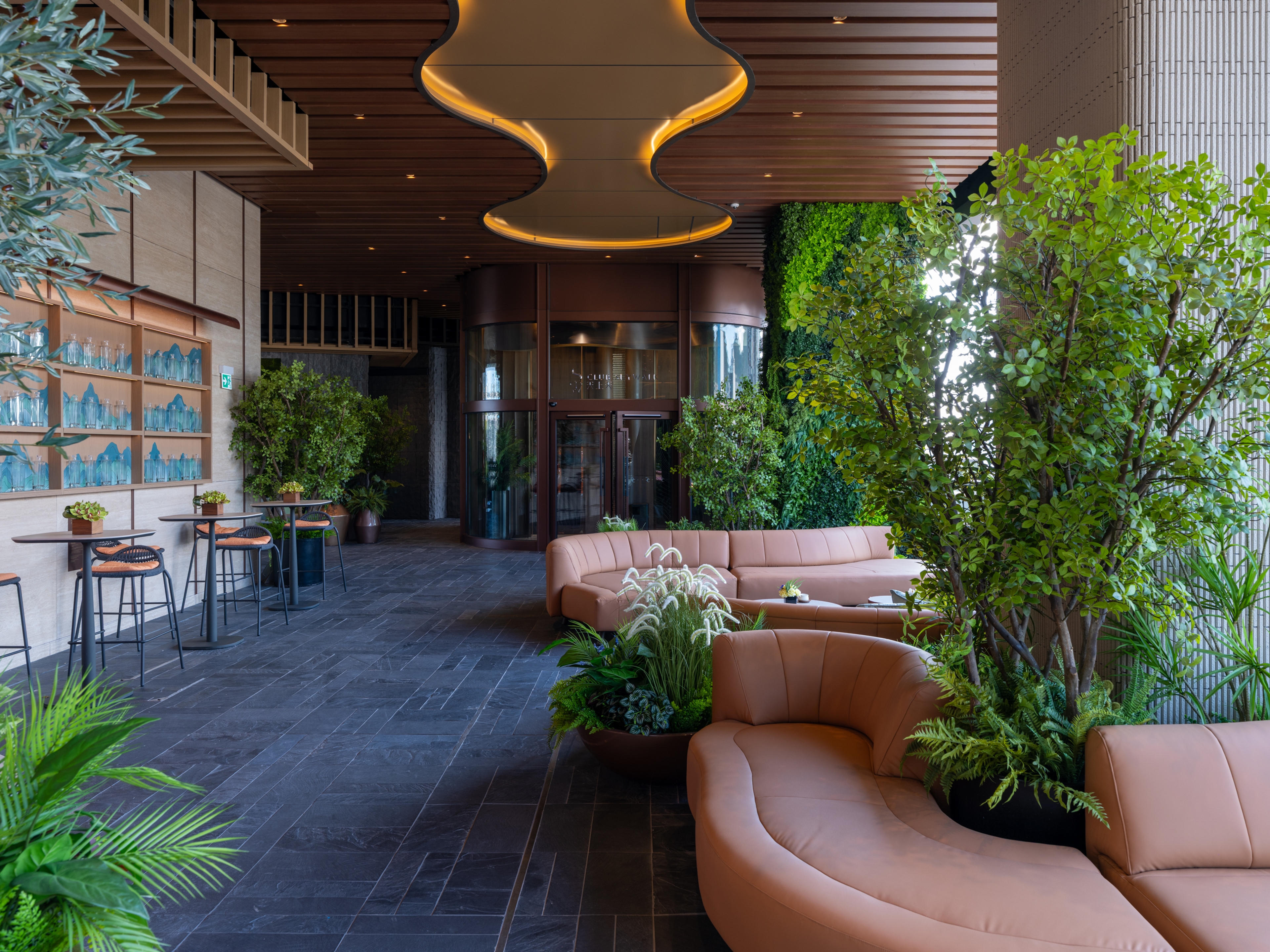 lounge area facing clubhouse entrance with feature light ceiling