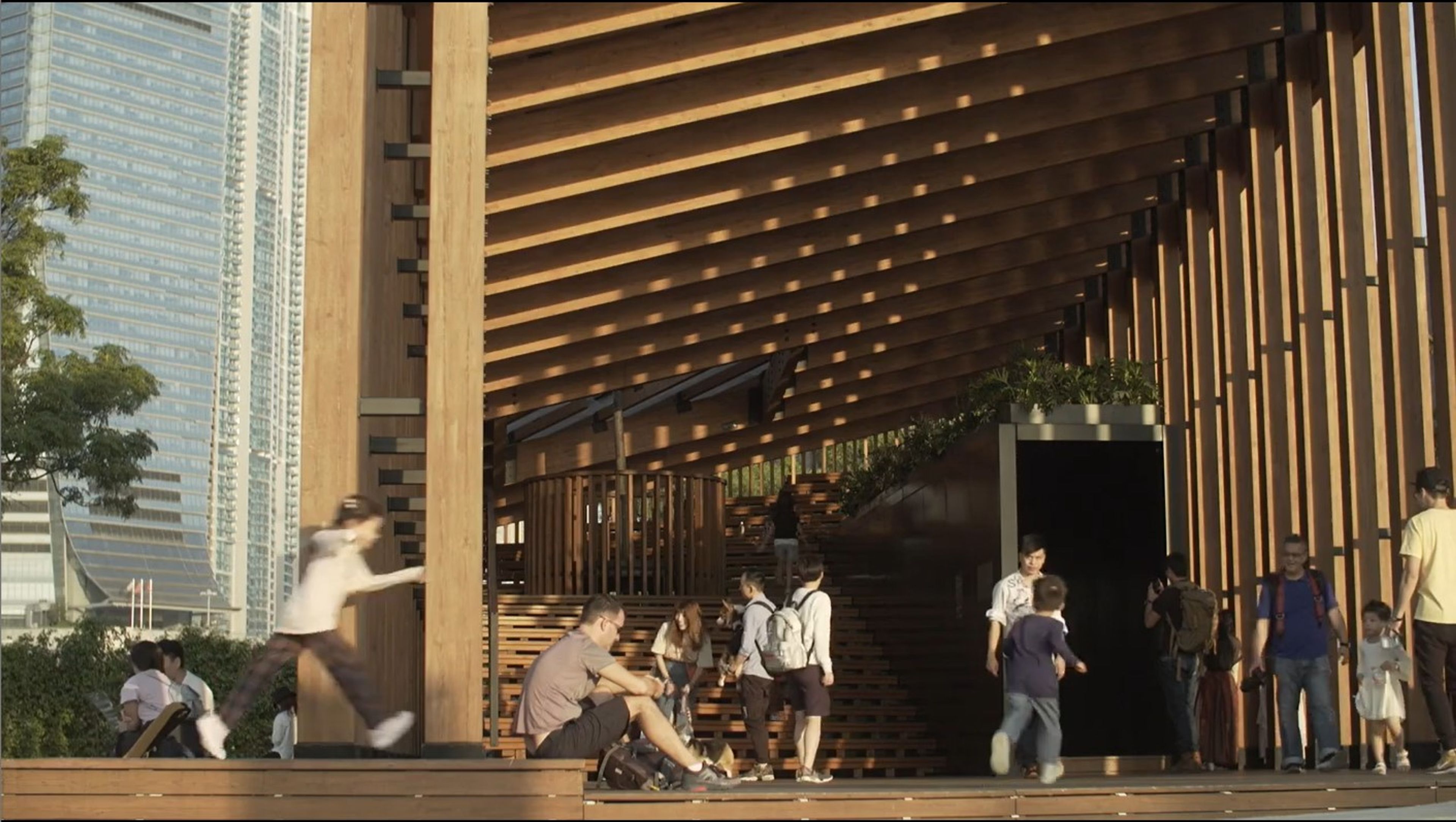 people gathering within timber pavilion