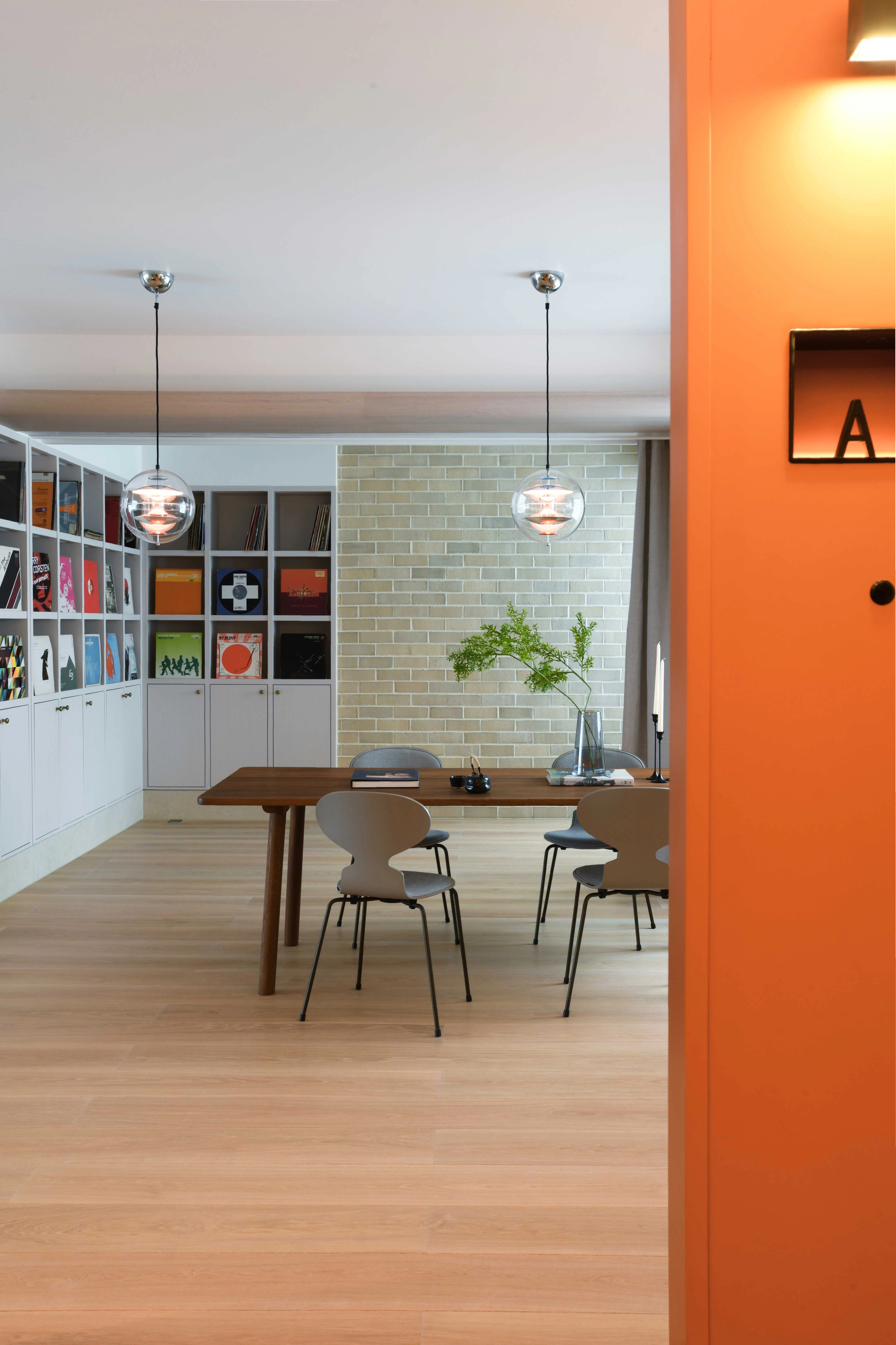 bright bespoke entrance door with dining space beyond