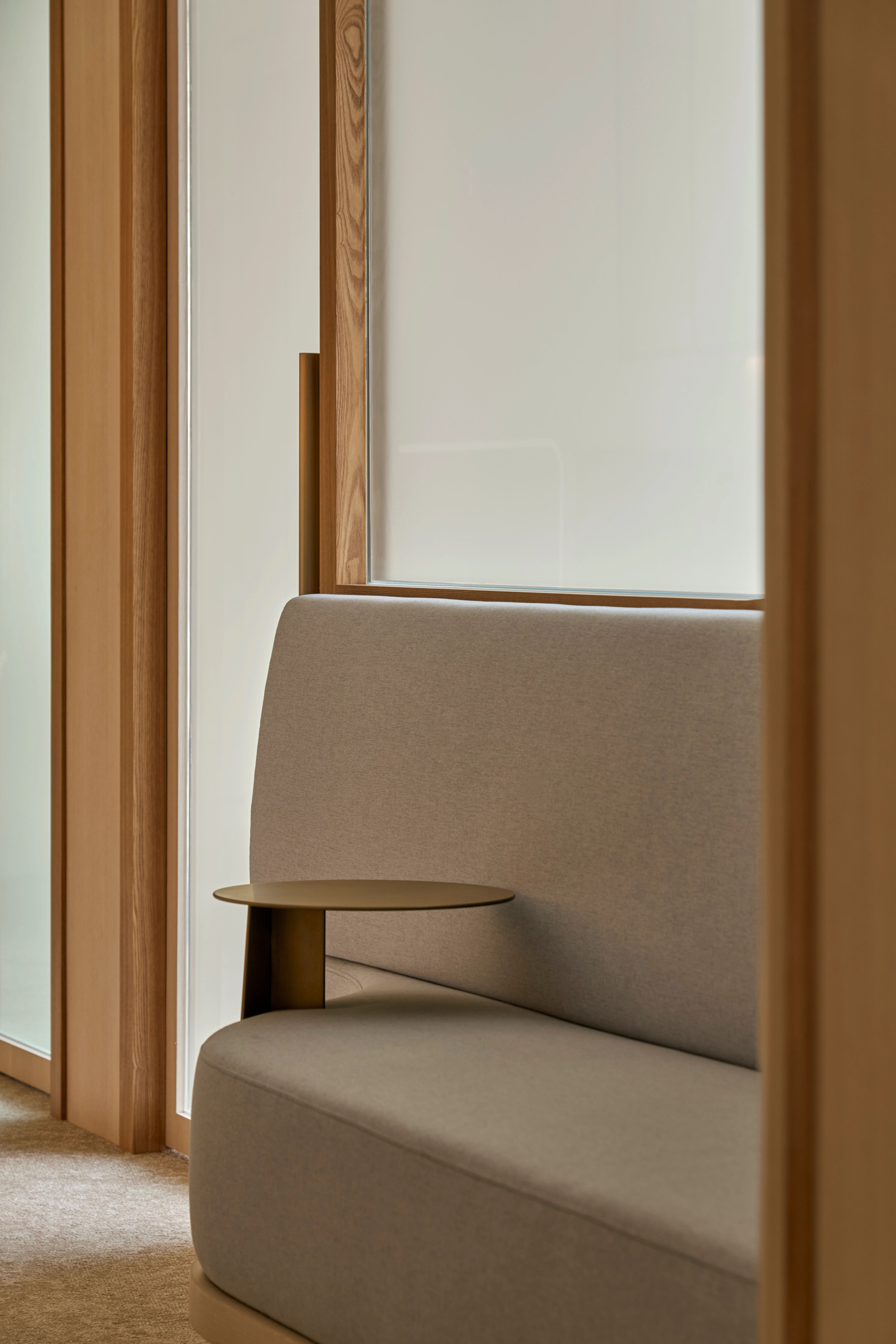 minimalist gray upholstery paired with the sleek side table