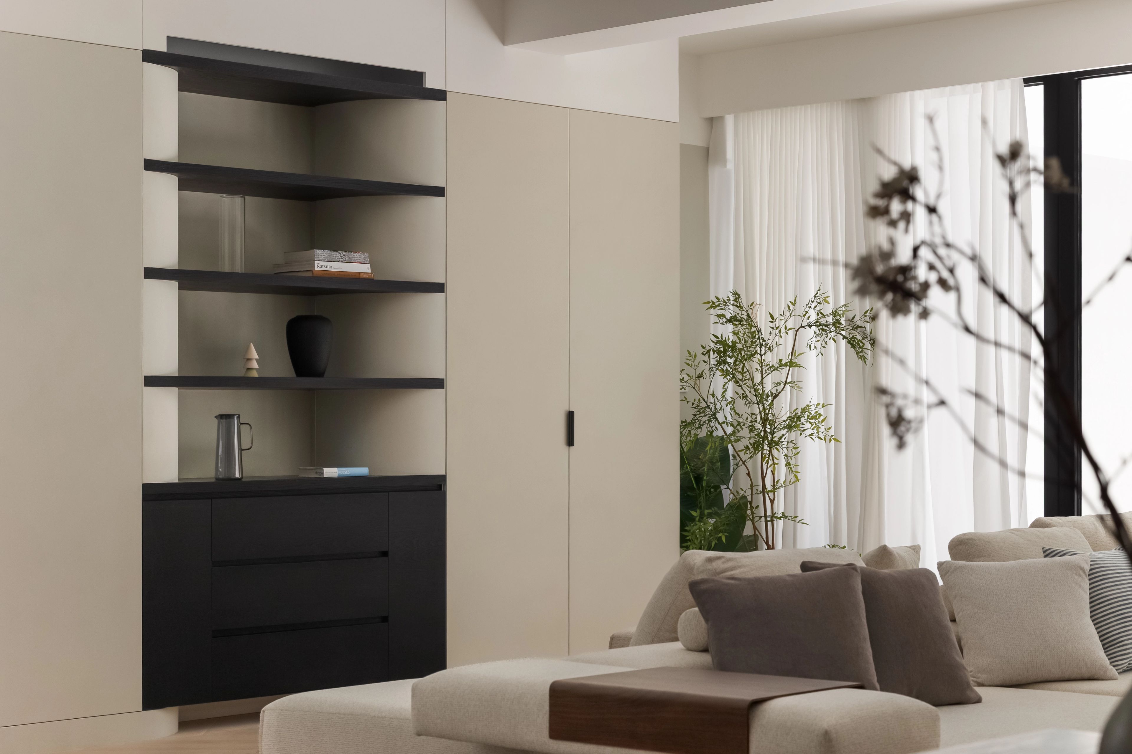 Built in joinery with light grey texture paint and sheer curtains
