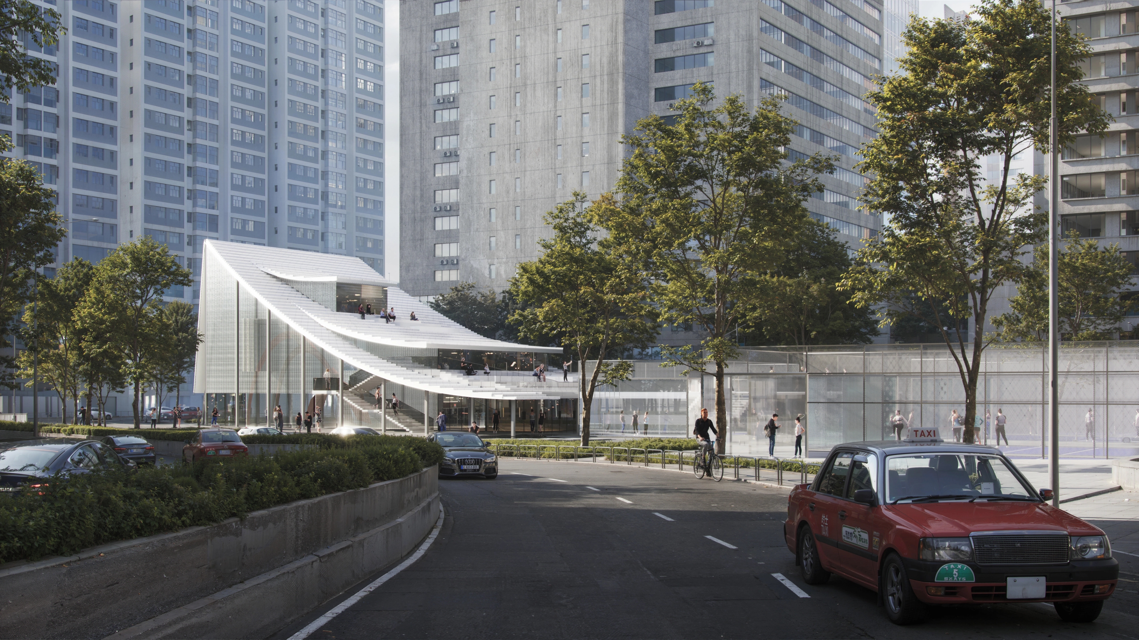 Modern glass pavilion with stepped white canopy and rooftop terraces amid high-rise apartment towers