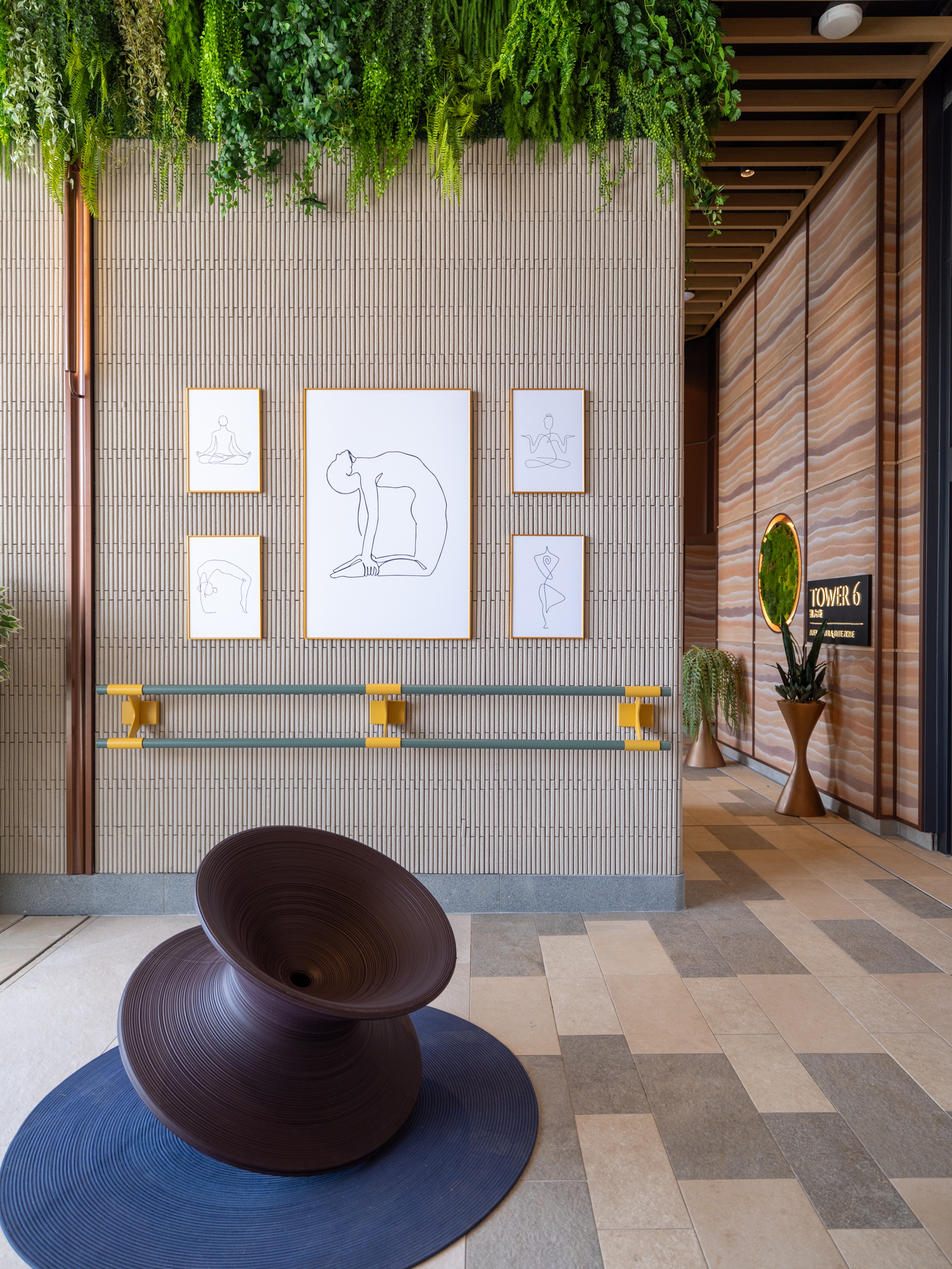 yoga area with rammed earth textured wall