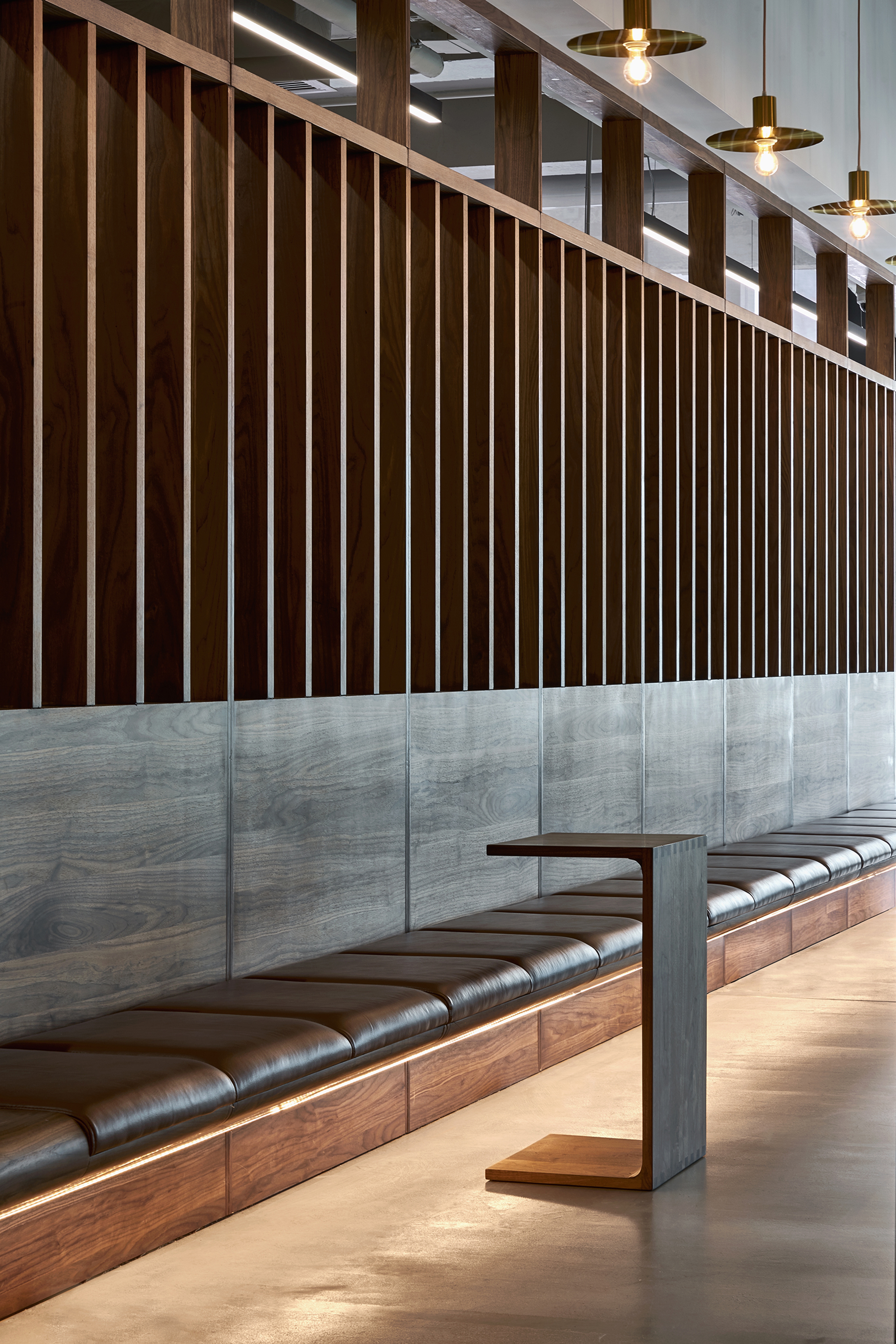 modern office interior reception area with long sitting bench