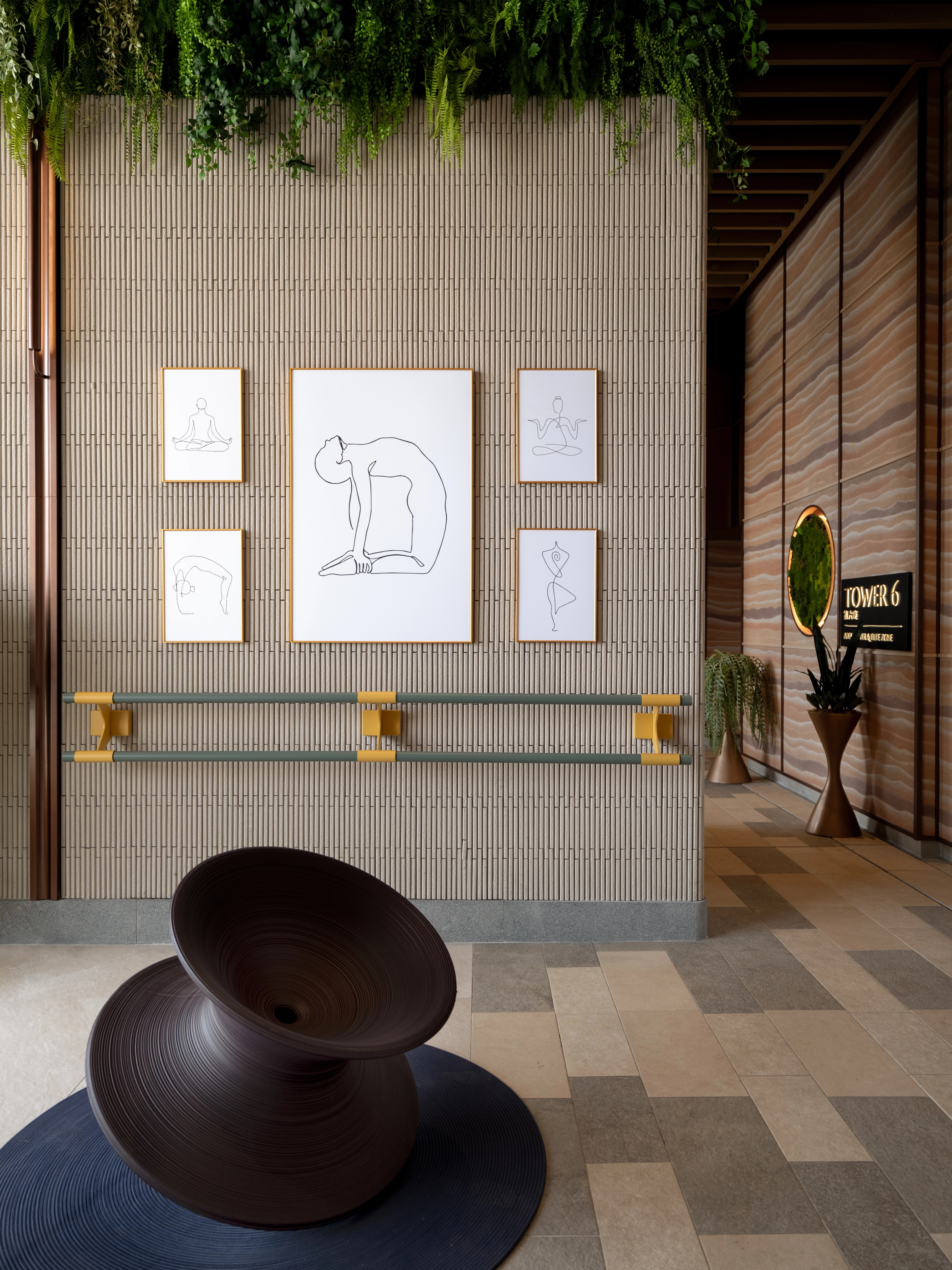 yoga area with rammed earth textured wall