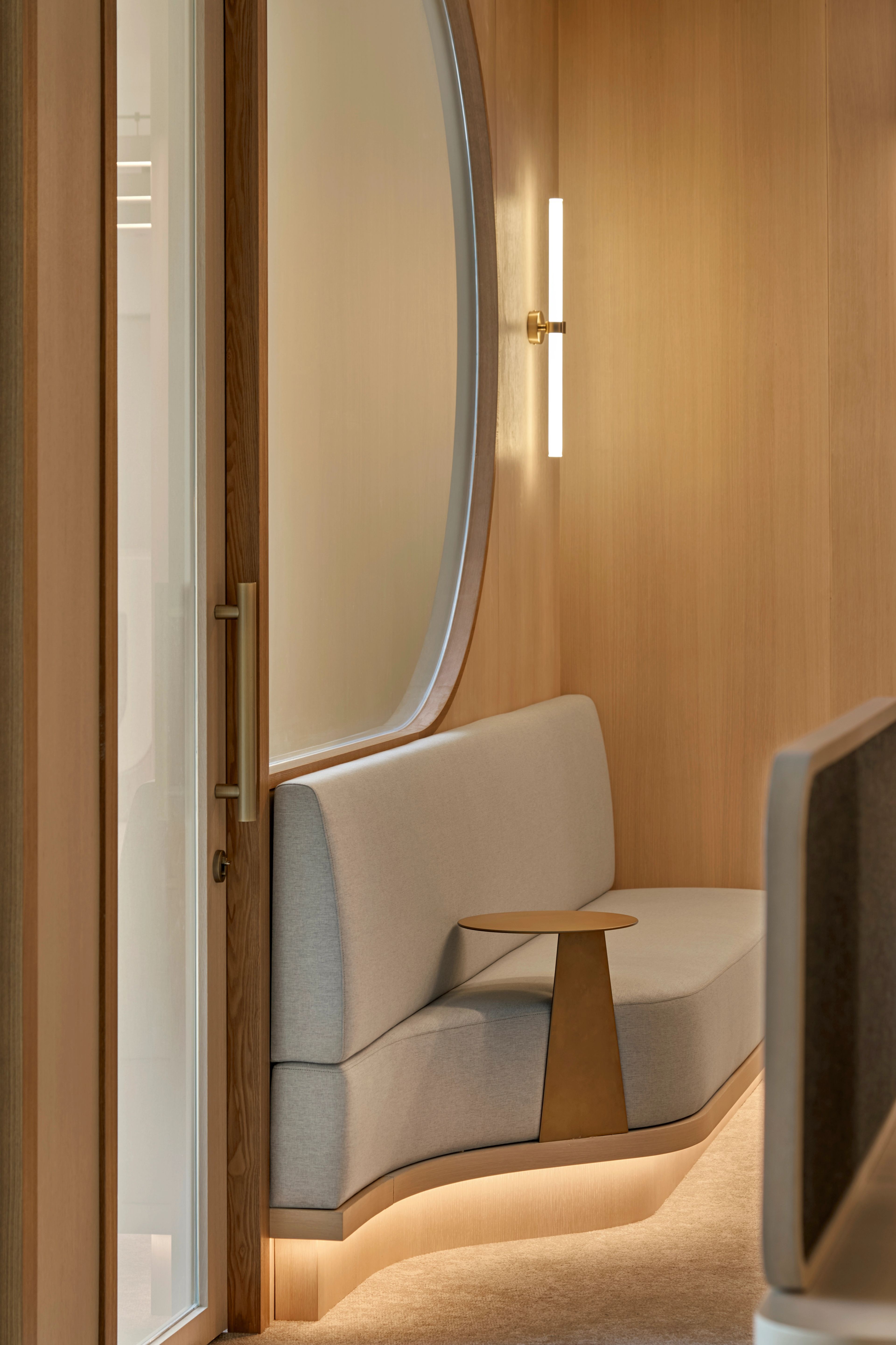 seating area illuminated by soft lighting within a warm, wooden backdrop