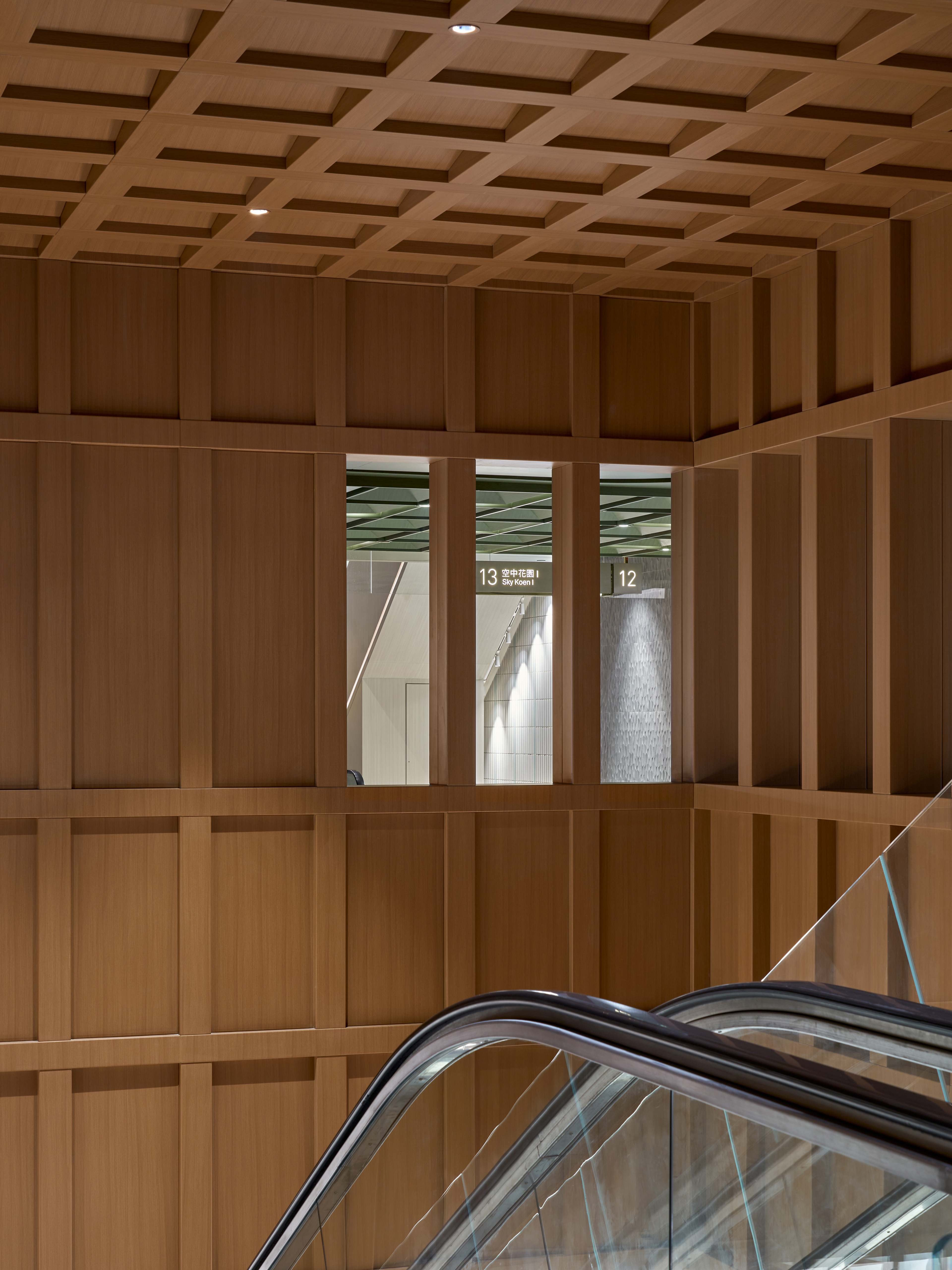 Wood atrium void with internal window opening