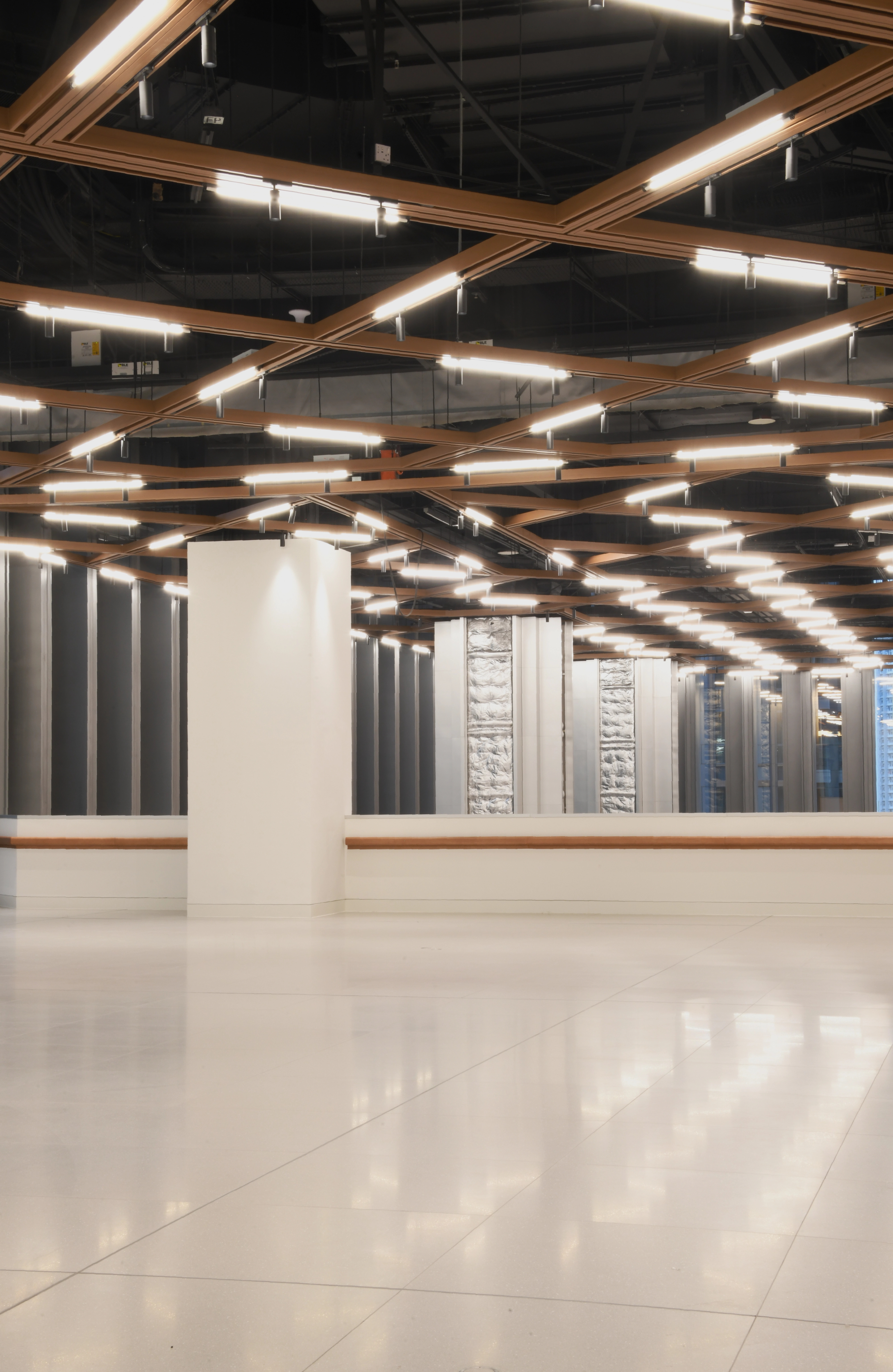 Tenth floor multifunction hall with timber ceiling and white flooring