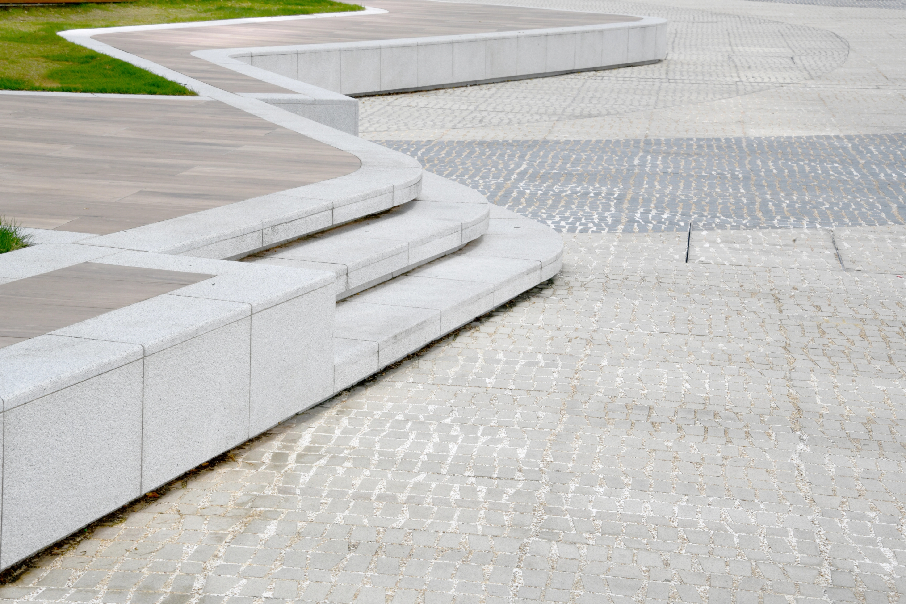 Detail of ground pavement and curved stone steps