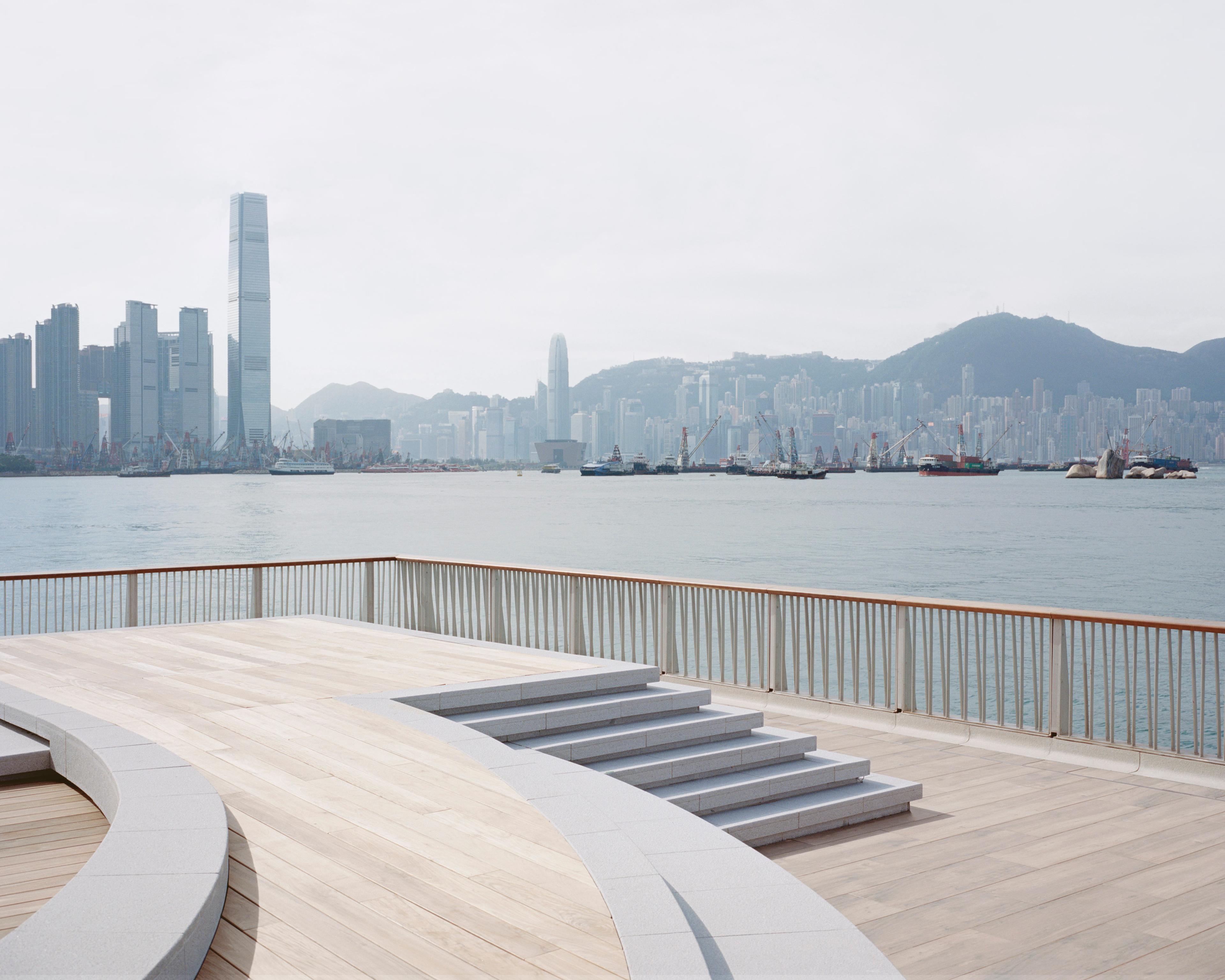 Curved steps with wood decking at end of pier overlooking Hong Kong harbour