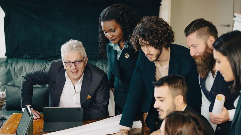 Small business owner working on laptop reviewing local SEO strategy