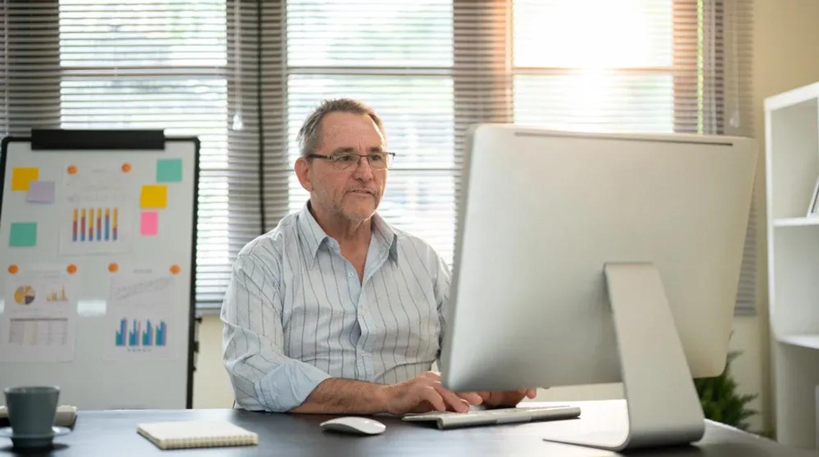 Small business owner reviewing local search rankings on computer