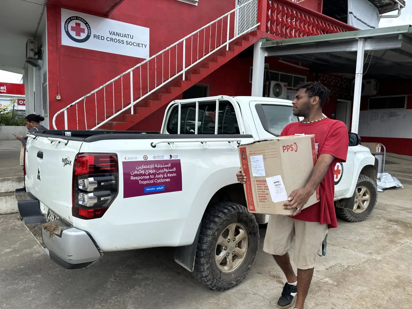 VRCS volunteer loading supplies for distribution at HQ Port Vila