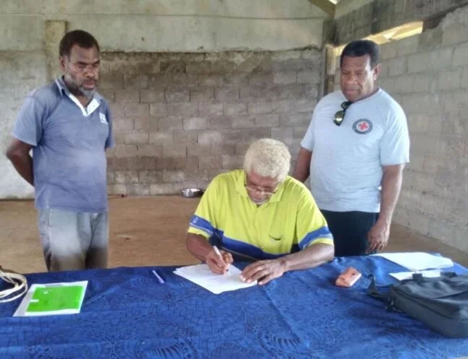 VRCS Branch Board Chairman Derick Bulu and Disaster Management Coordinator Augustin Garae witnessed Chief Hatchinson John Bogiri at Anvoro village signing the Memorandum of Understanding.