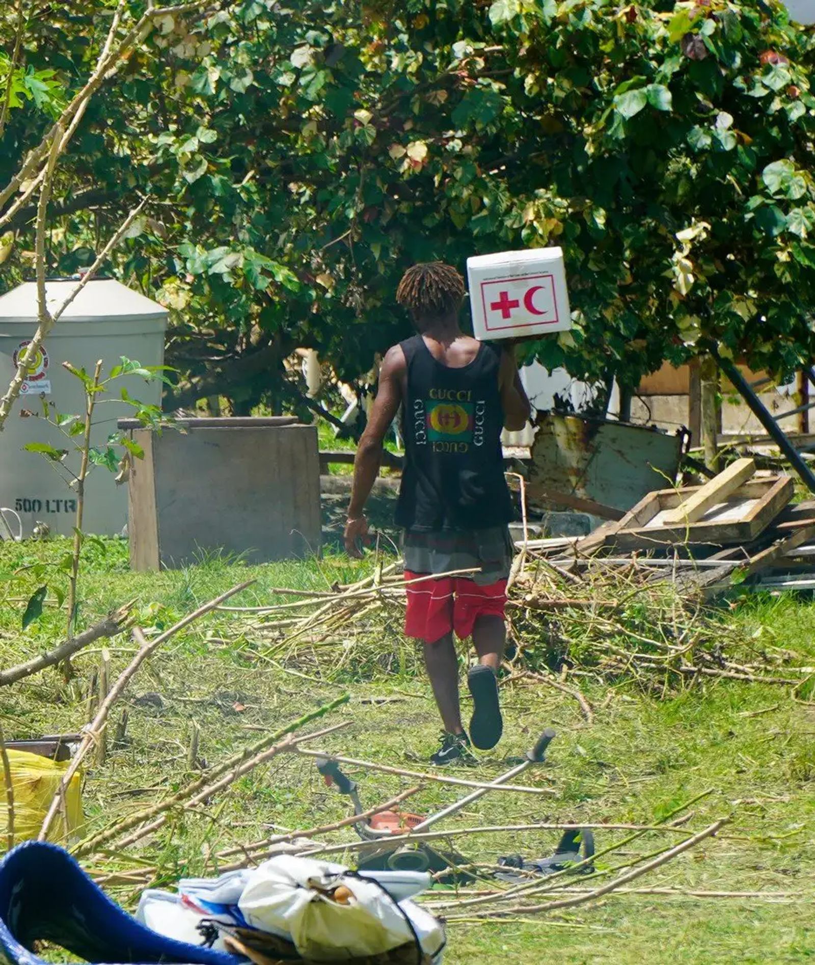 Vanuatu Red Cross volunteer distributing local supplies