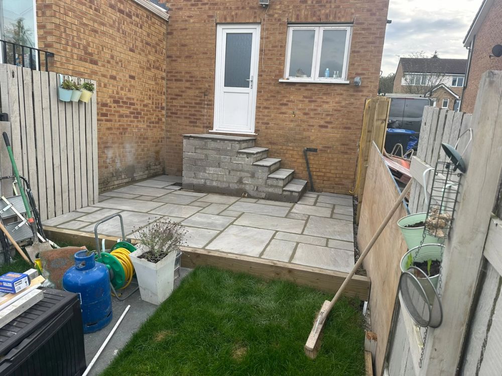 Completed step renovation project featuring newly built brick steps and paved patio area outside a property in Harrogate.