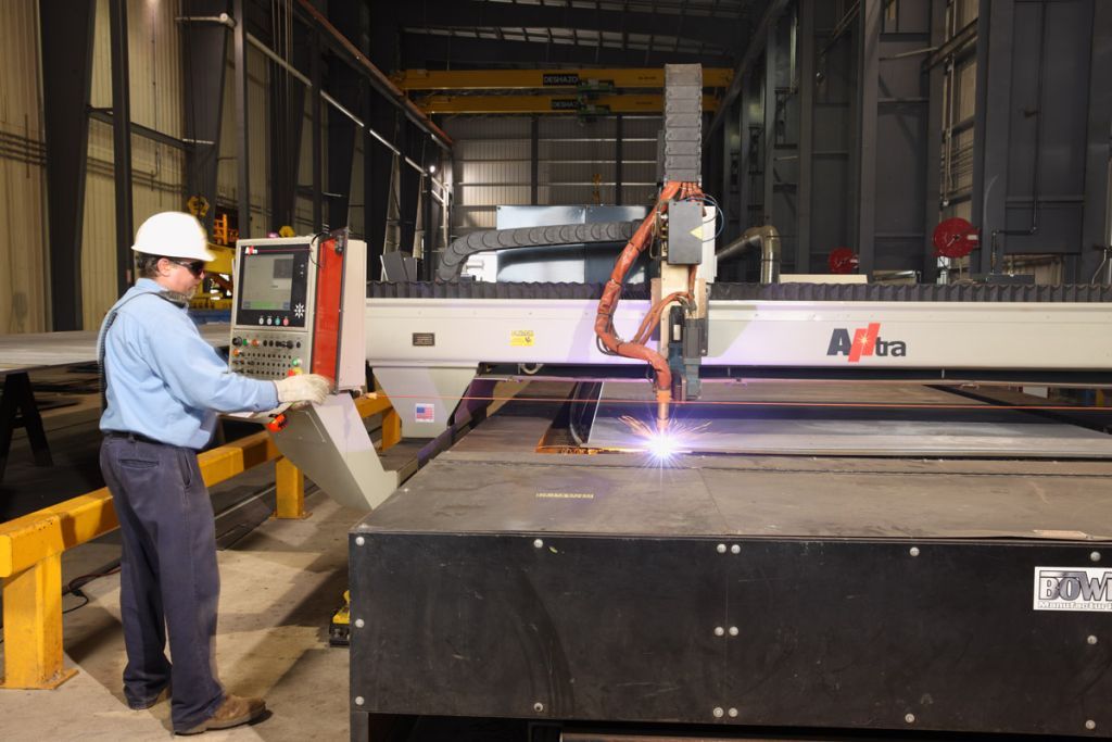 the process of plasma cutting, a method used to cut through electrically conductive metals.