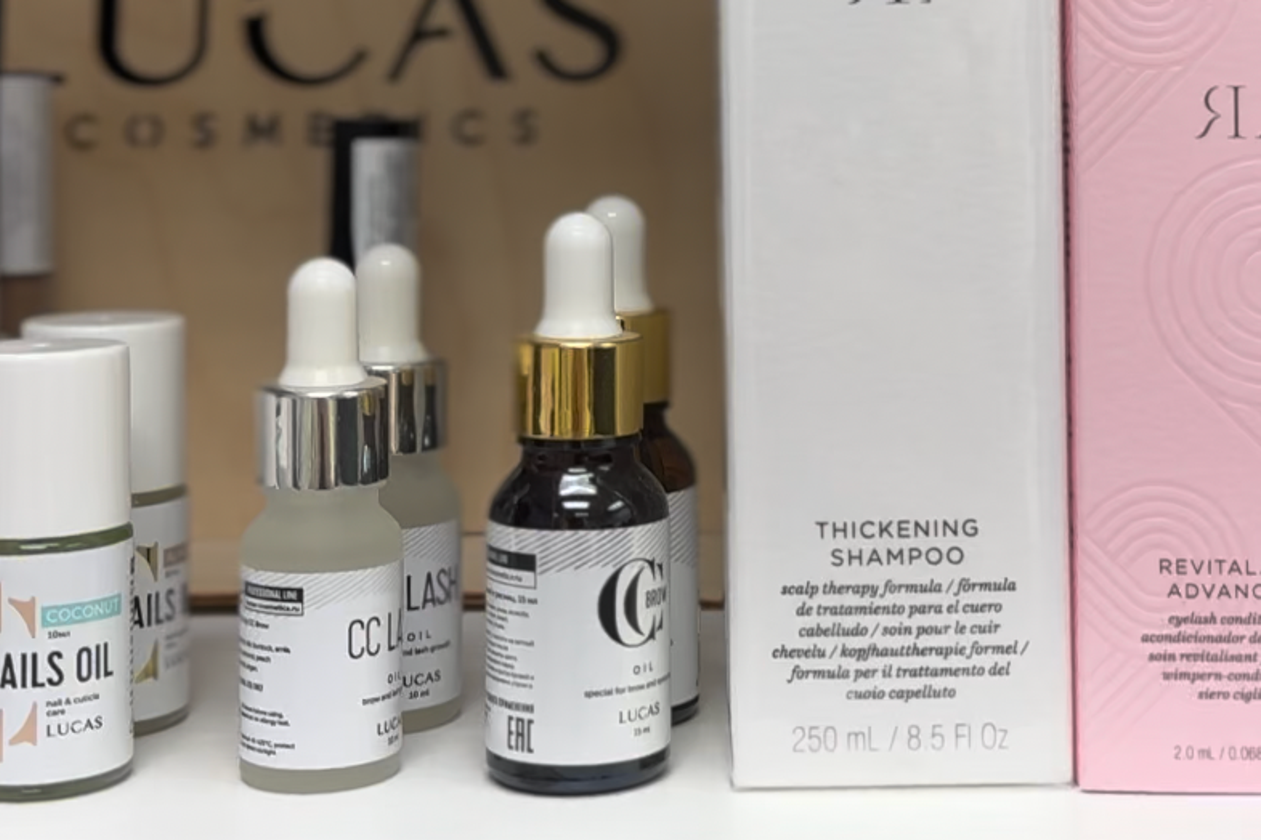Shelf of lash-conditioning and aftercare products.