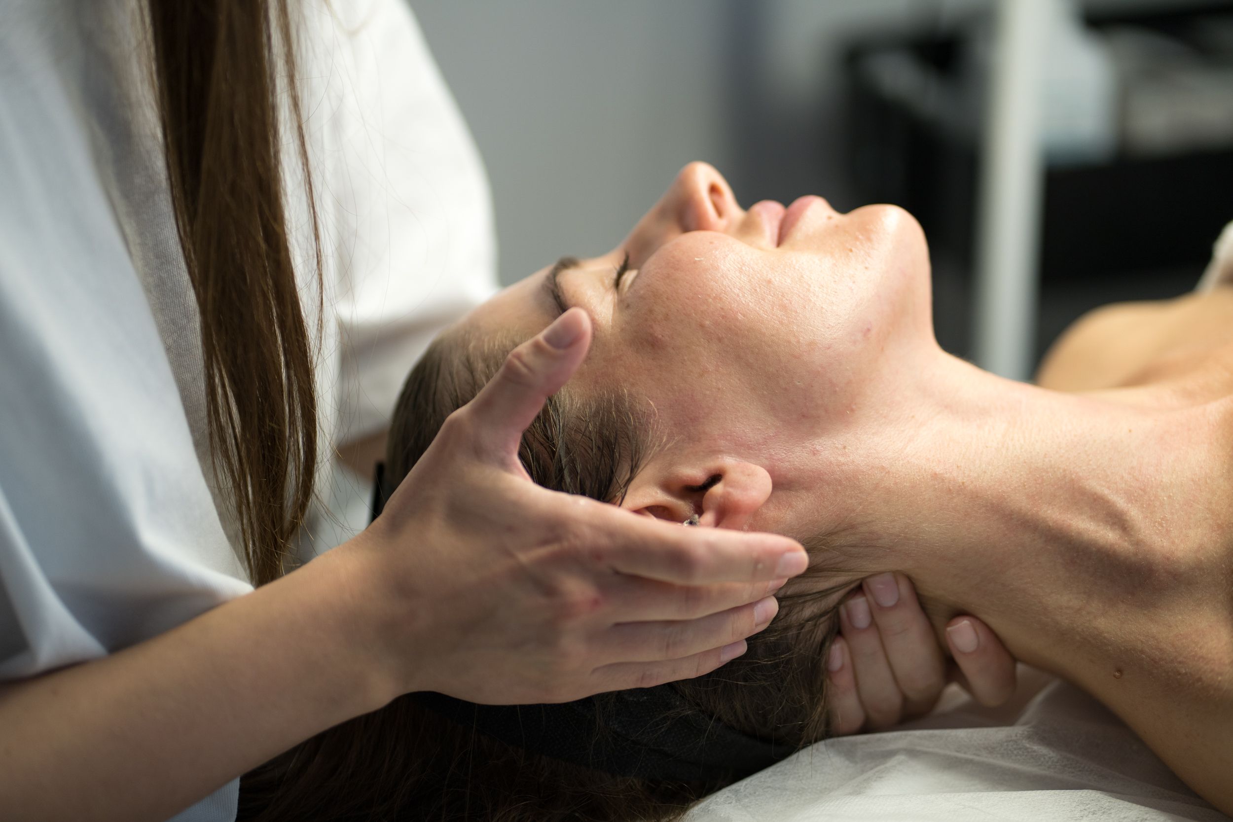 Person receiving a neck massage.