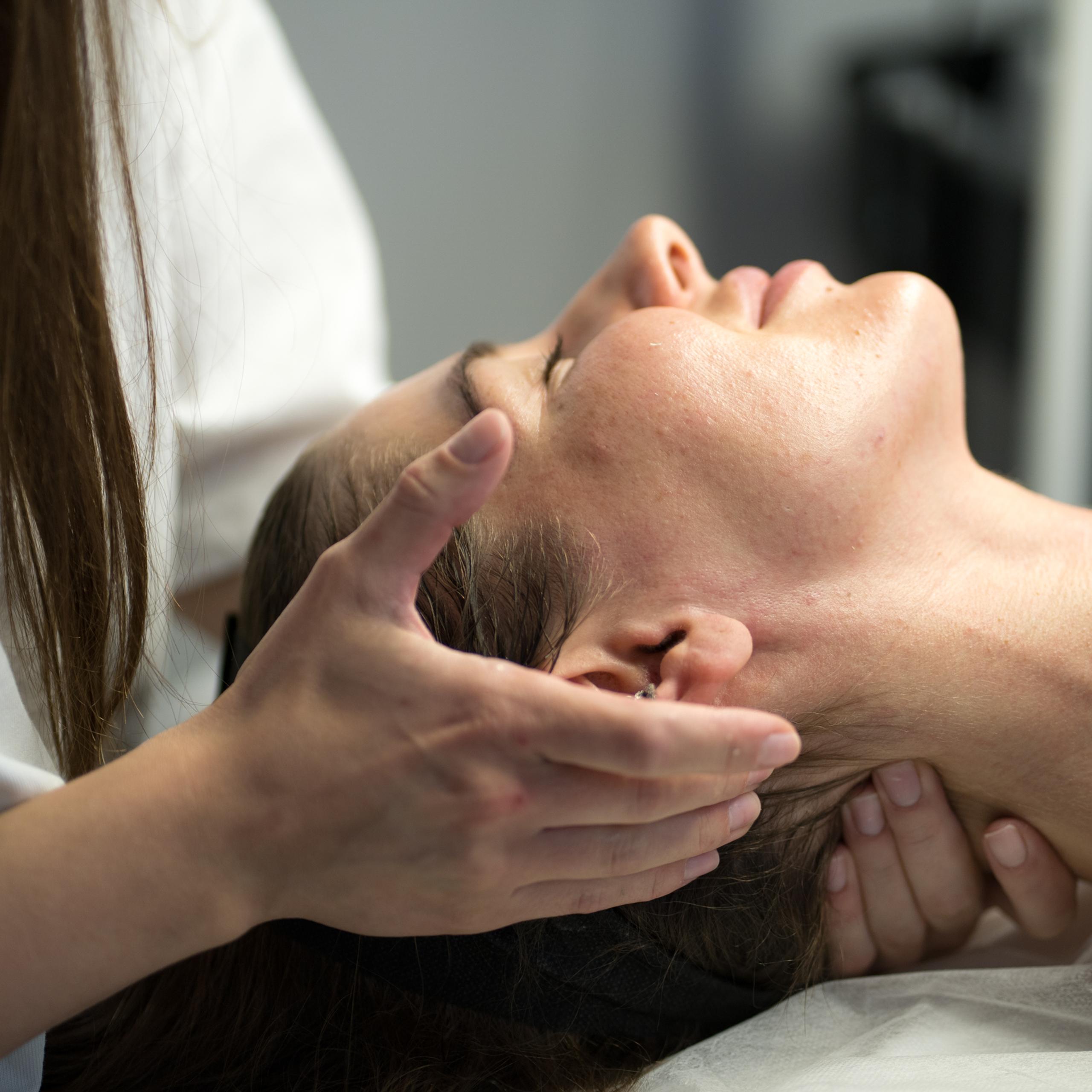 Person receiving a neck massage.