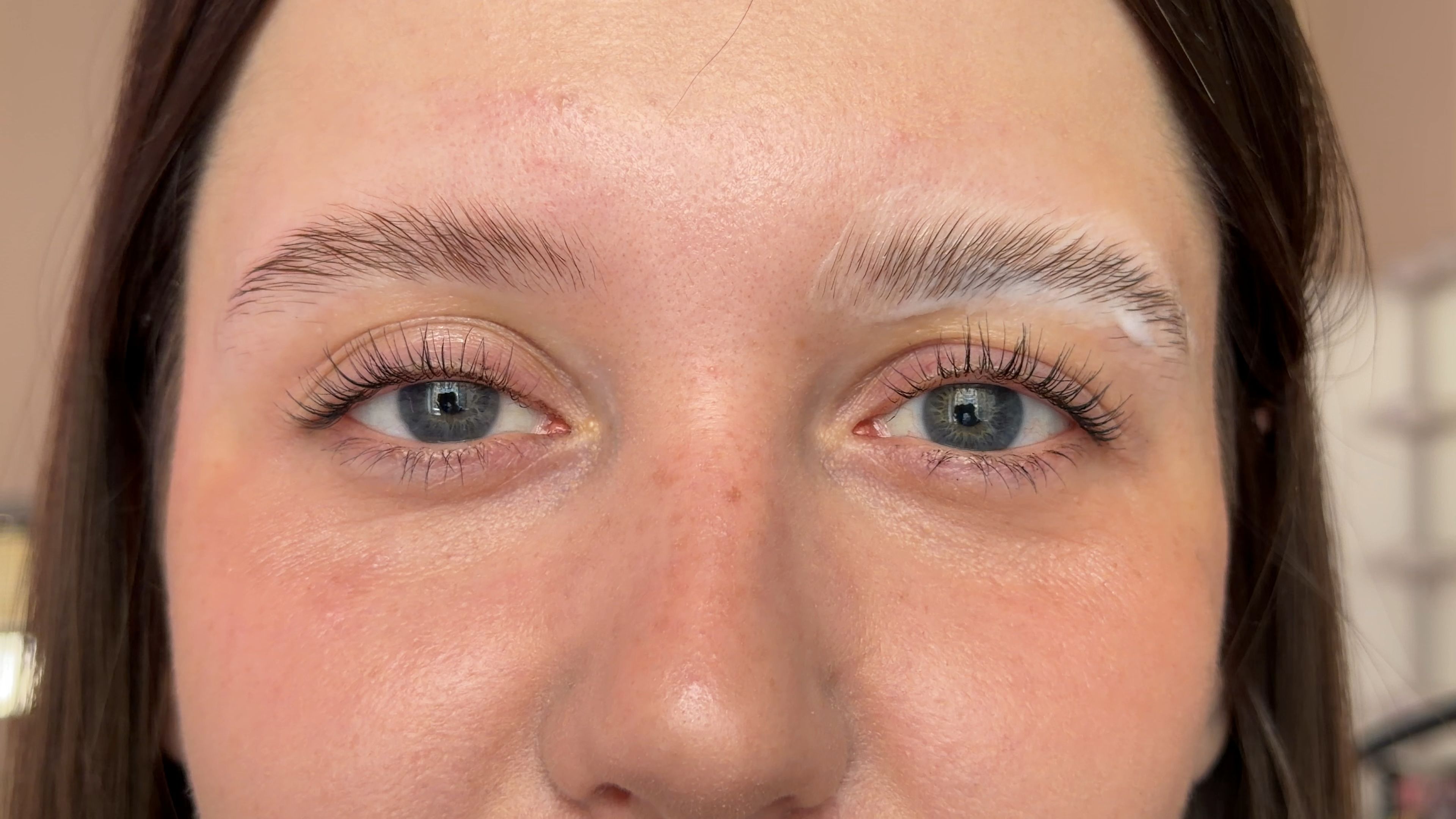 Close-up of a Beauty Republic client with freshly laminated, lifted eyebrows in Woburn, MA.