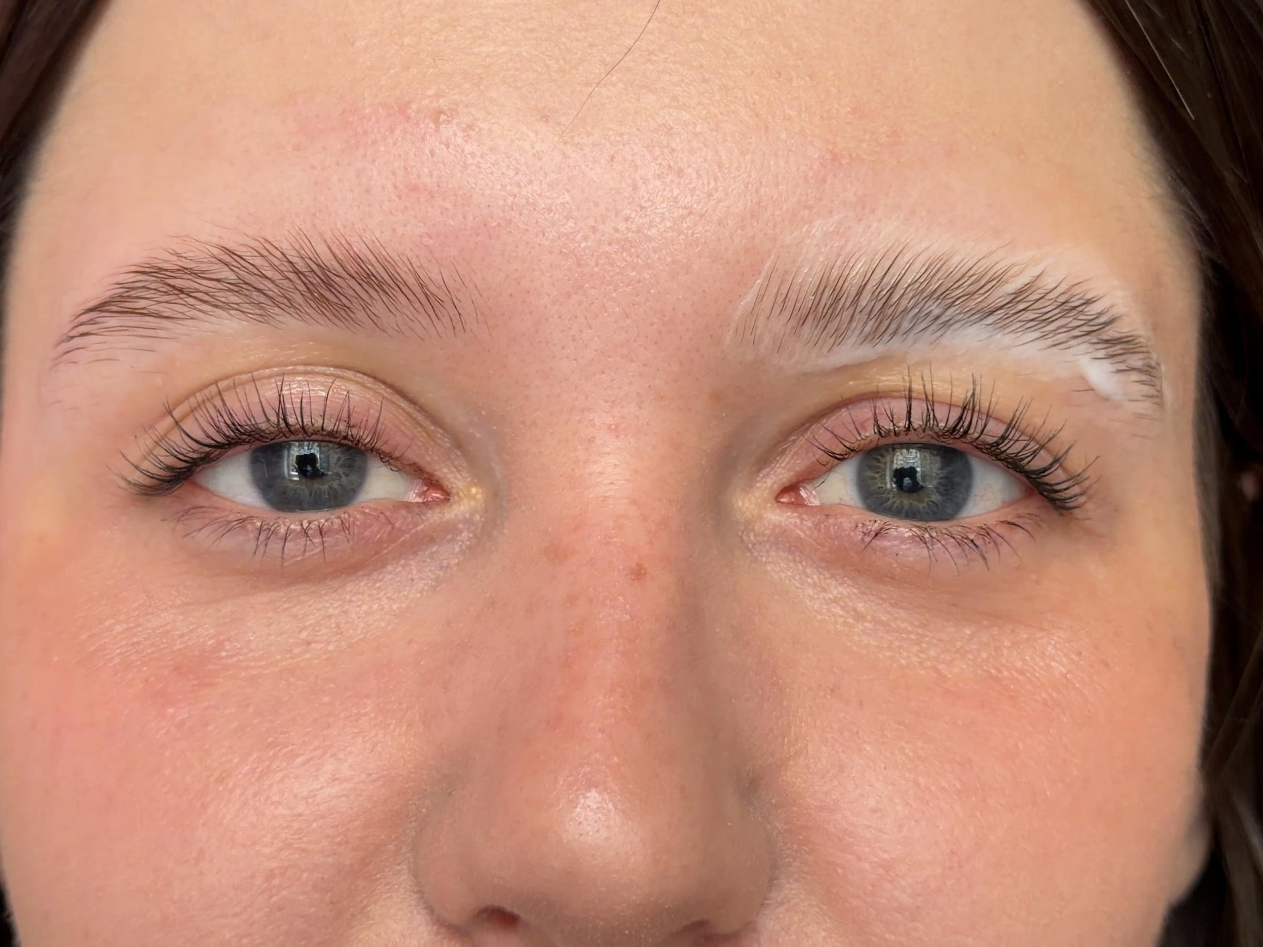 Close-up of a Beauty Republic client with freshly laminated, lifted eyebrows in Woburn, MA.