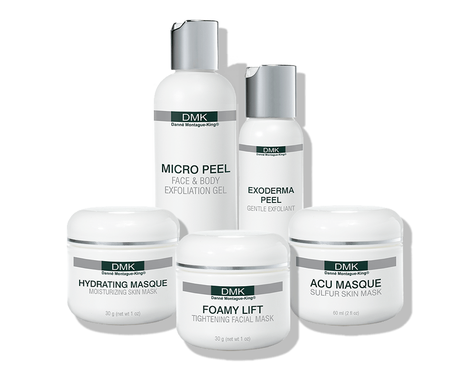 Five white DMK skincare products including exfoliation gels and masks.