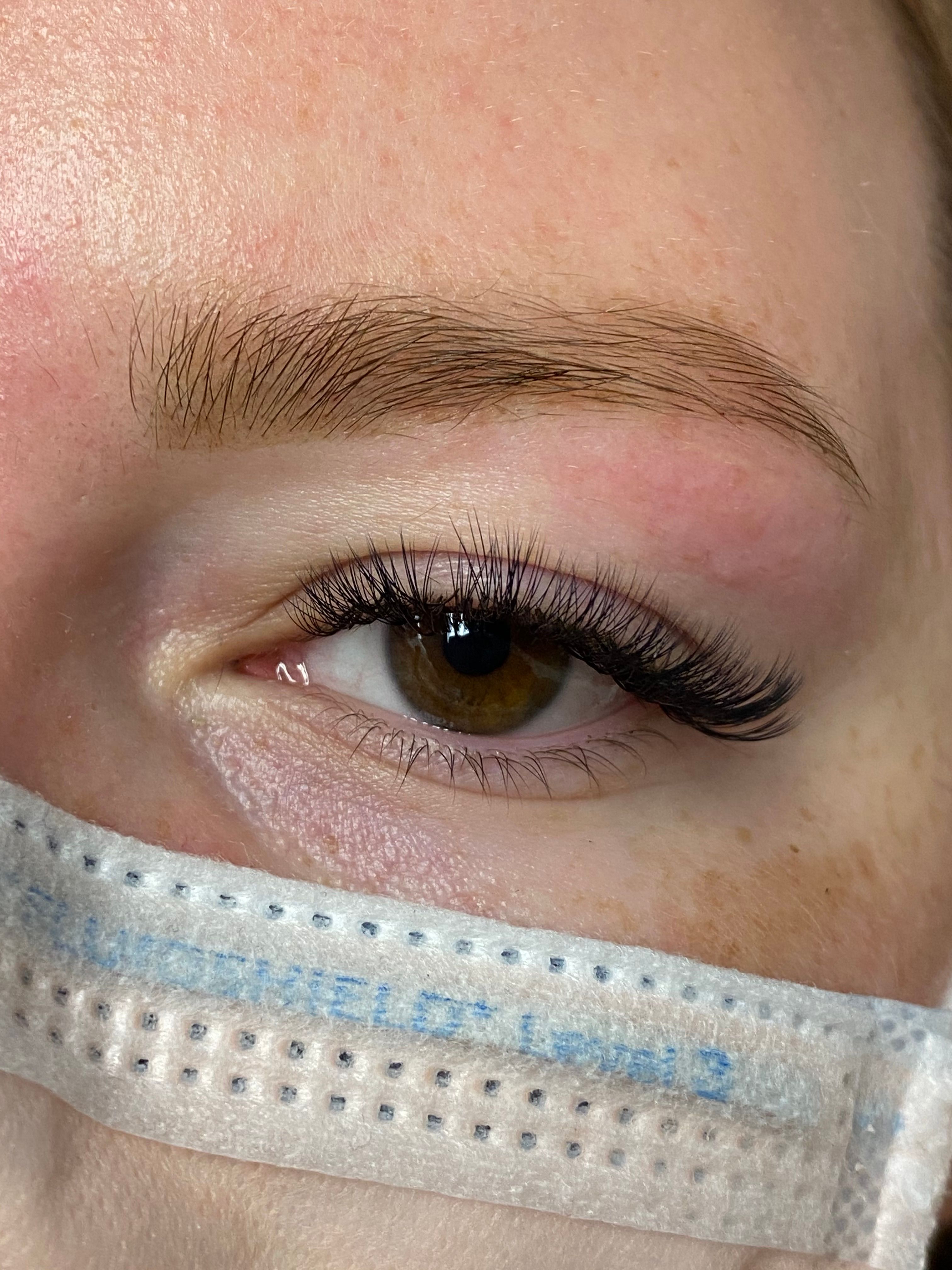 After brow tinting: the same eyebrow appears darker and more defined.