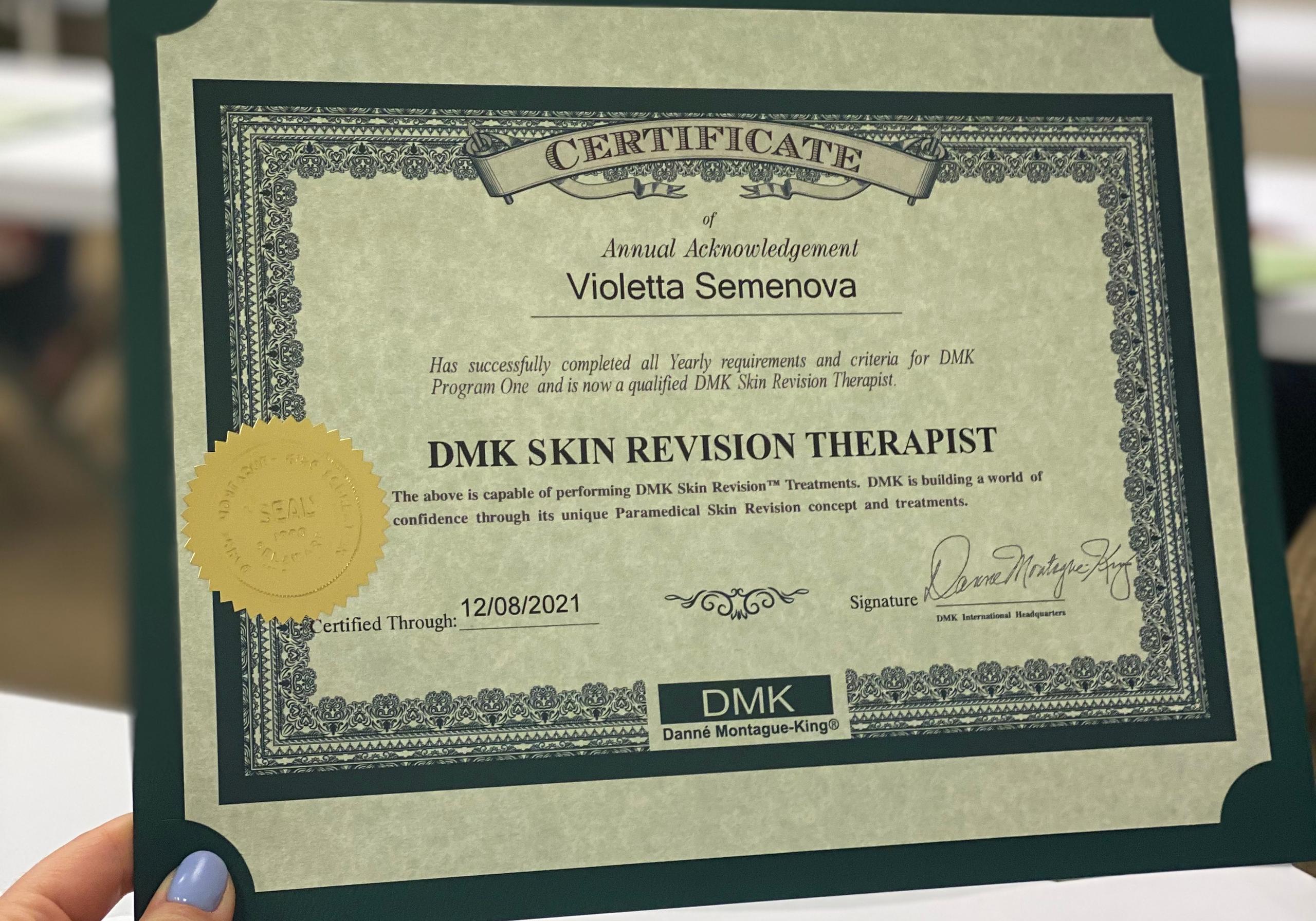 A green-framed DMK Skin Revision Therapist certificate for Violetta Semenova, dated 12/08/2021.
