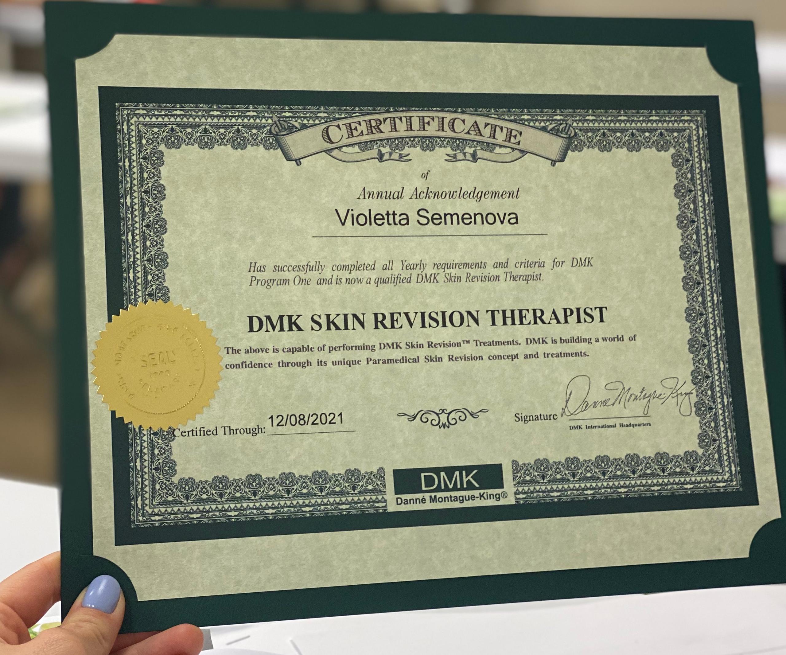 A green-framed DMK Skin Revision Therapist certificate for Violetta Semenova, dated 12/08/2021.