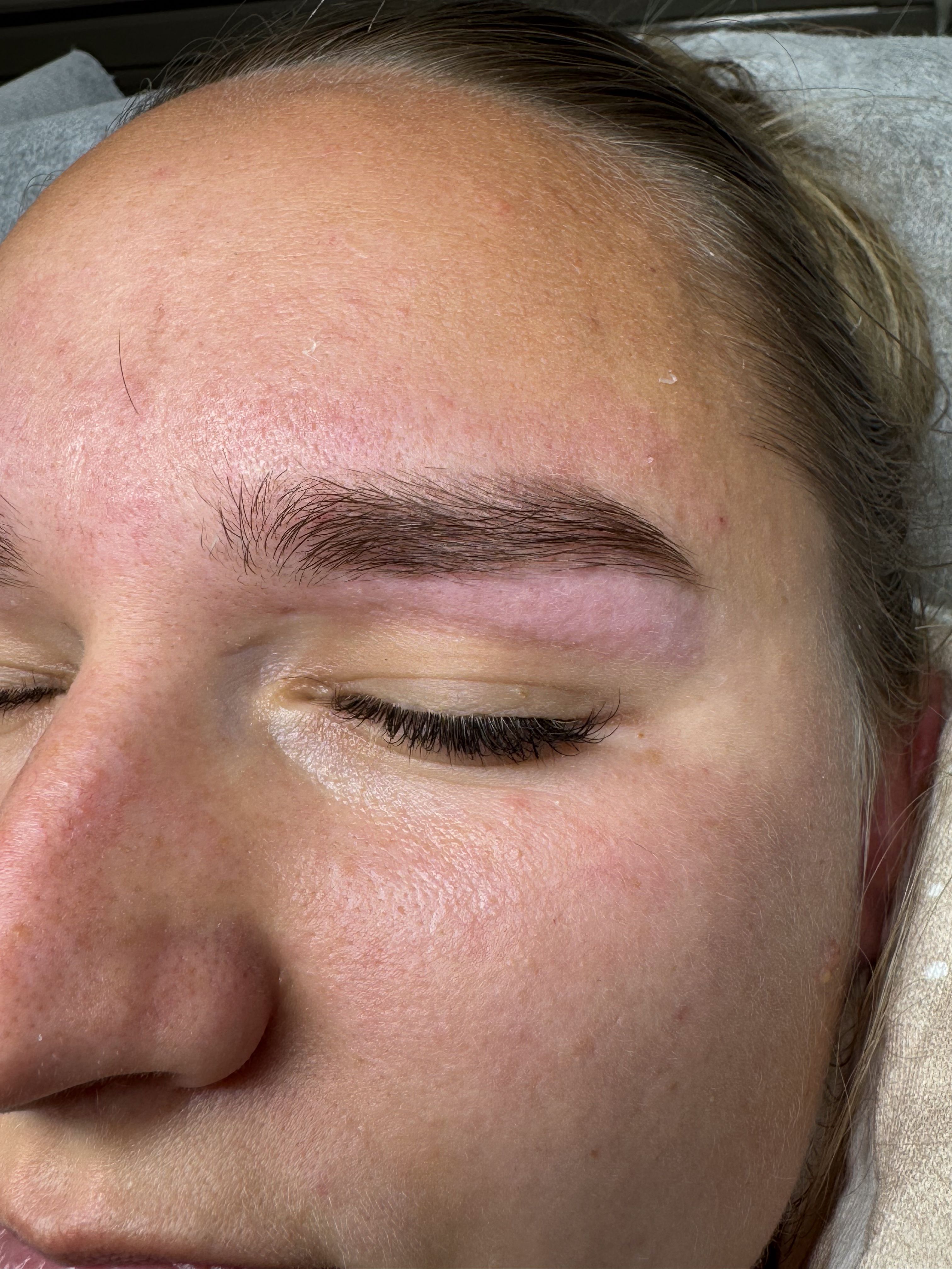 After brow tinting: the same eyebrow looks darker, fuller, and sharply defined.